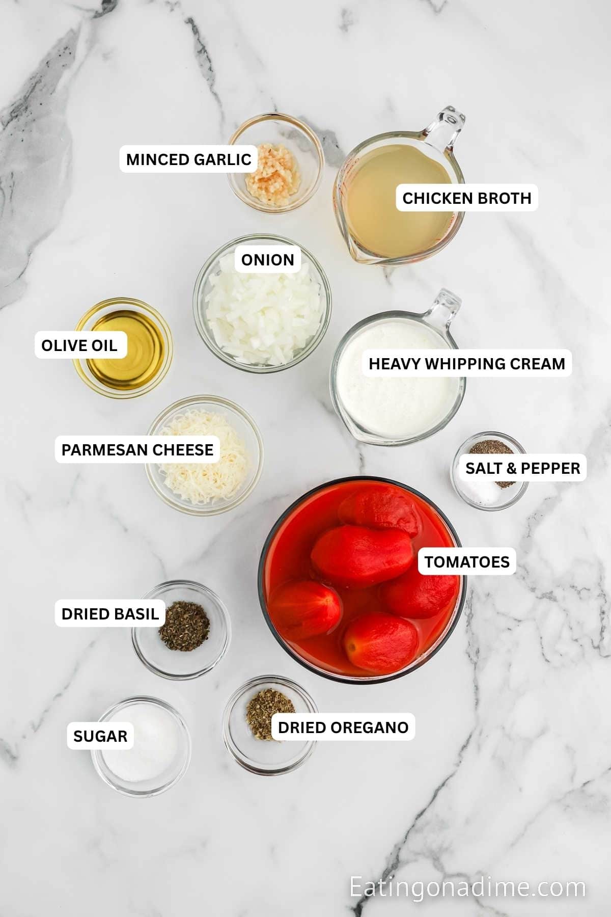Ingredients for recipe: oregano, sugar, basil, tomatoes, salt, pepper, Parmesan cheese, heavy whipping cream, olive oil, onion, chicken broth and minced garlic.