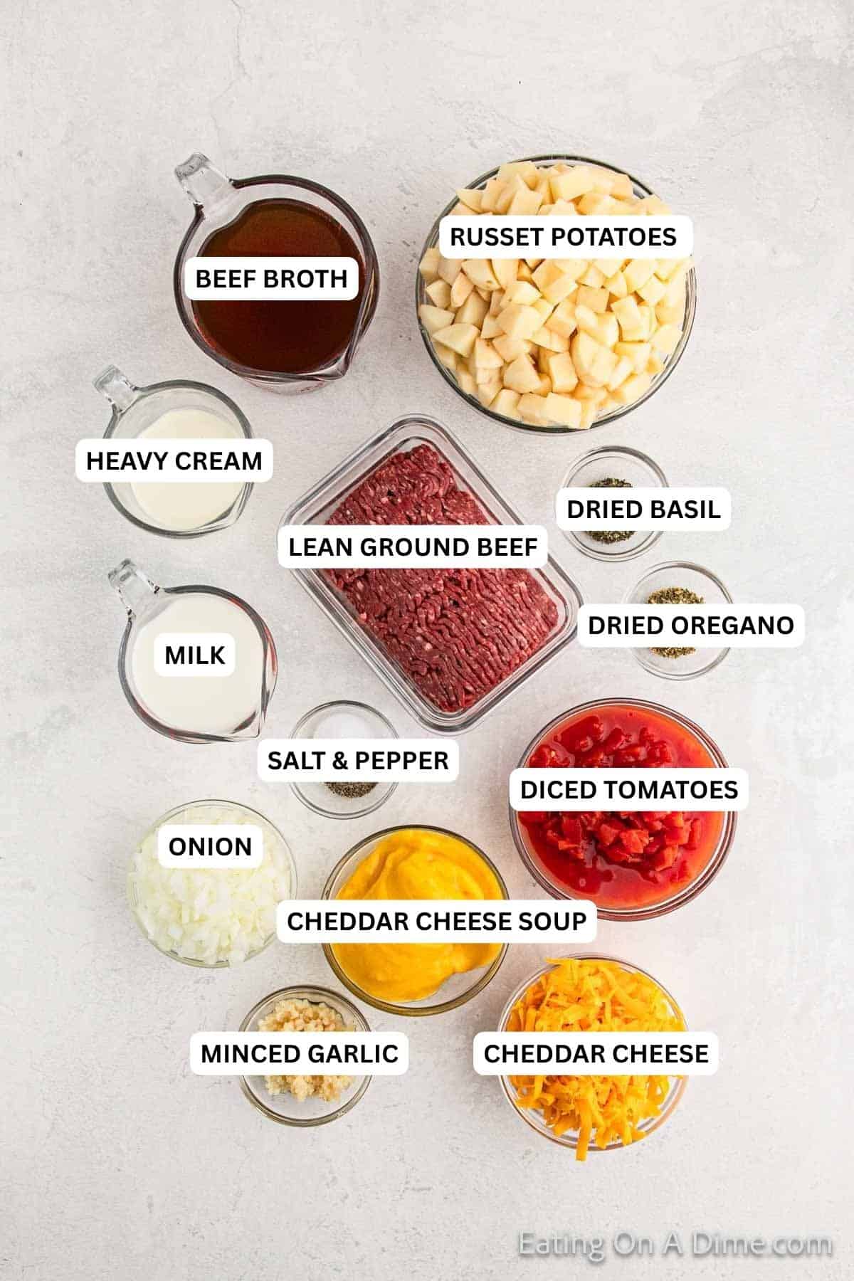 Ingredients for recpe: beef broth, russet potatoes, heavy cream, lean ground beef, dried basil, dried oregano, milk, salt and pepper, diced tomatoes, onion, cheddar cheese soup, minced garlic and cheddar cheese.