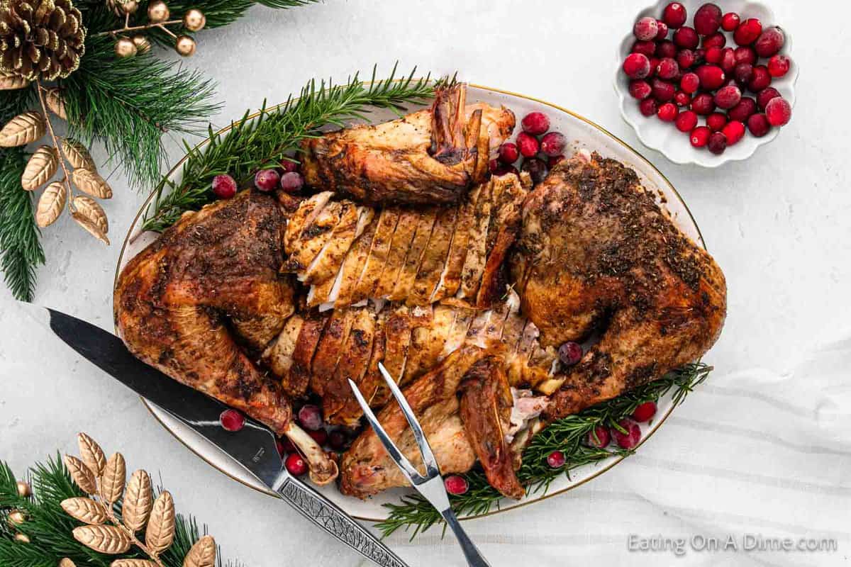 Spatchcock turkey carved and on a large platter.