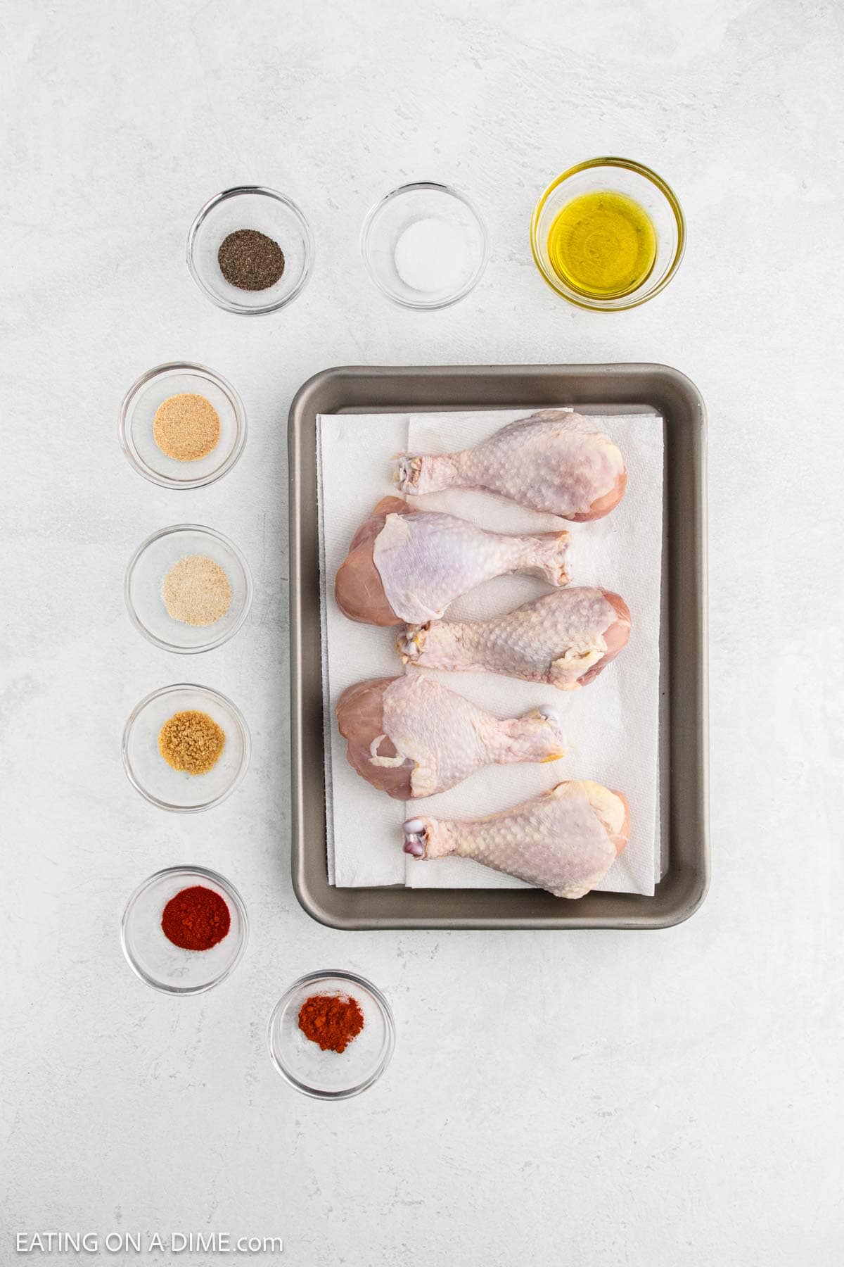 Ingredients - Chicken drumsticks, olive oil, salt, pepper, garlic powder, onion powder, paprika, ground mustard, cayenne pepper