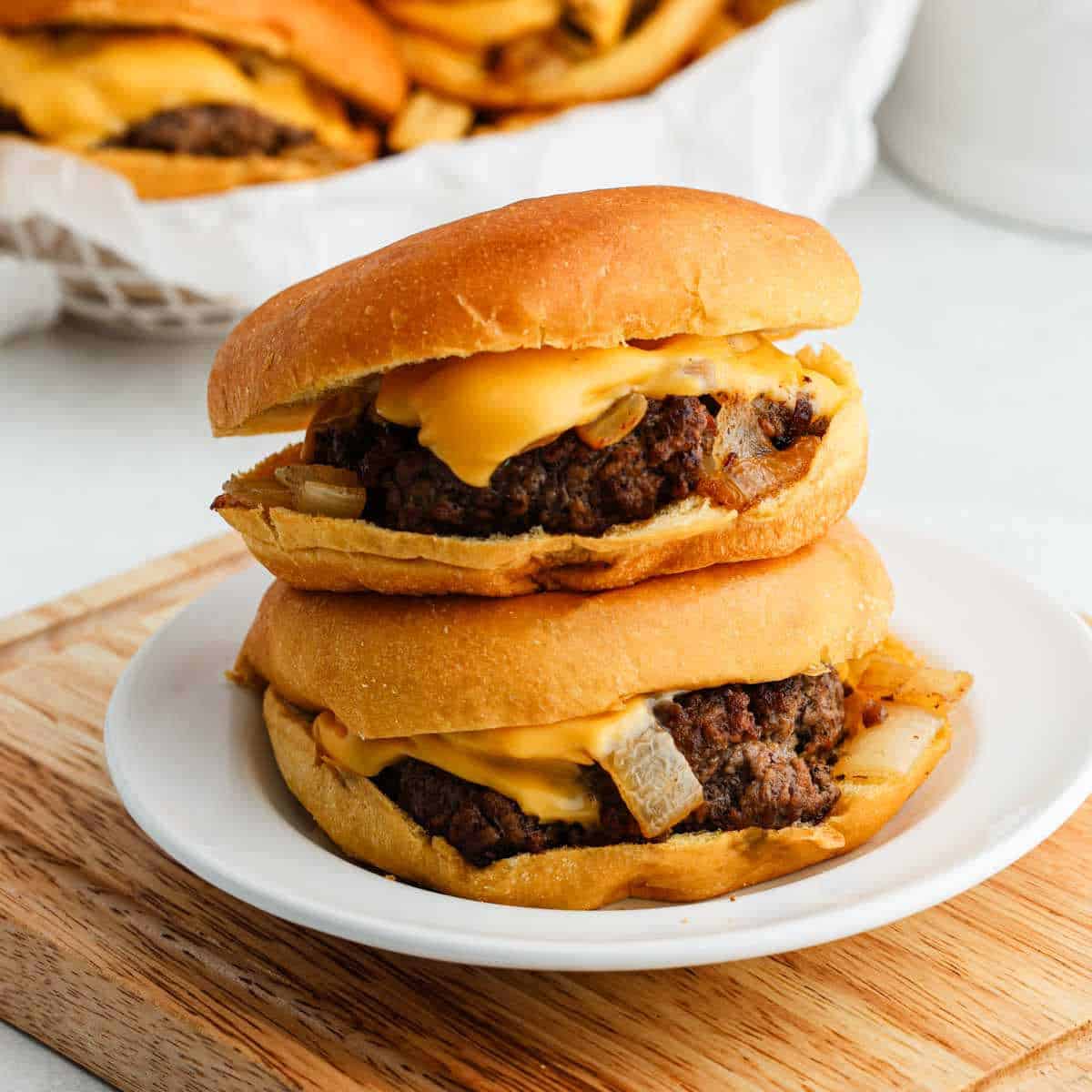 Butter Burgers stacked on a plate