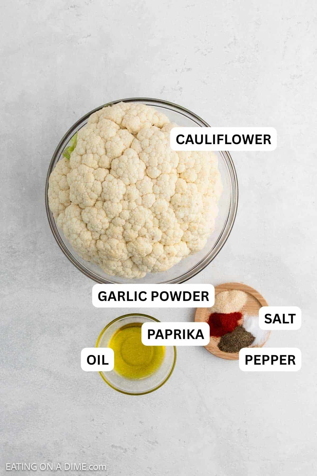 Ingredients needed for this recipe includes cauliflower, olive oil, garlic powder, paprika, salt and pepper.