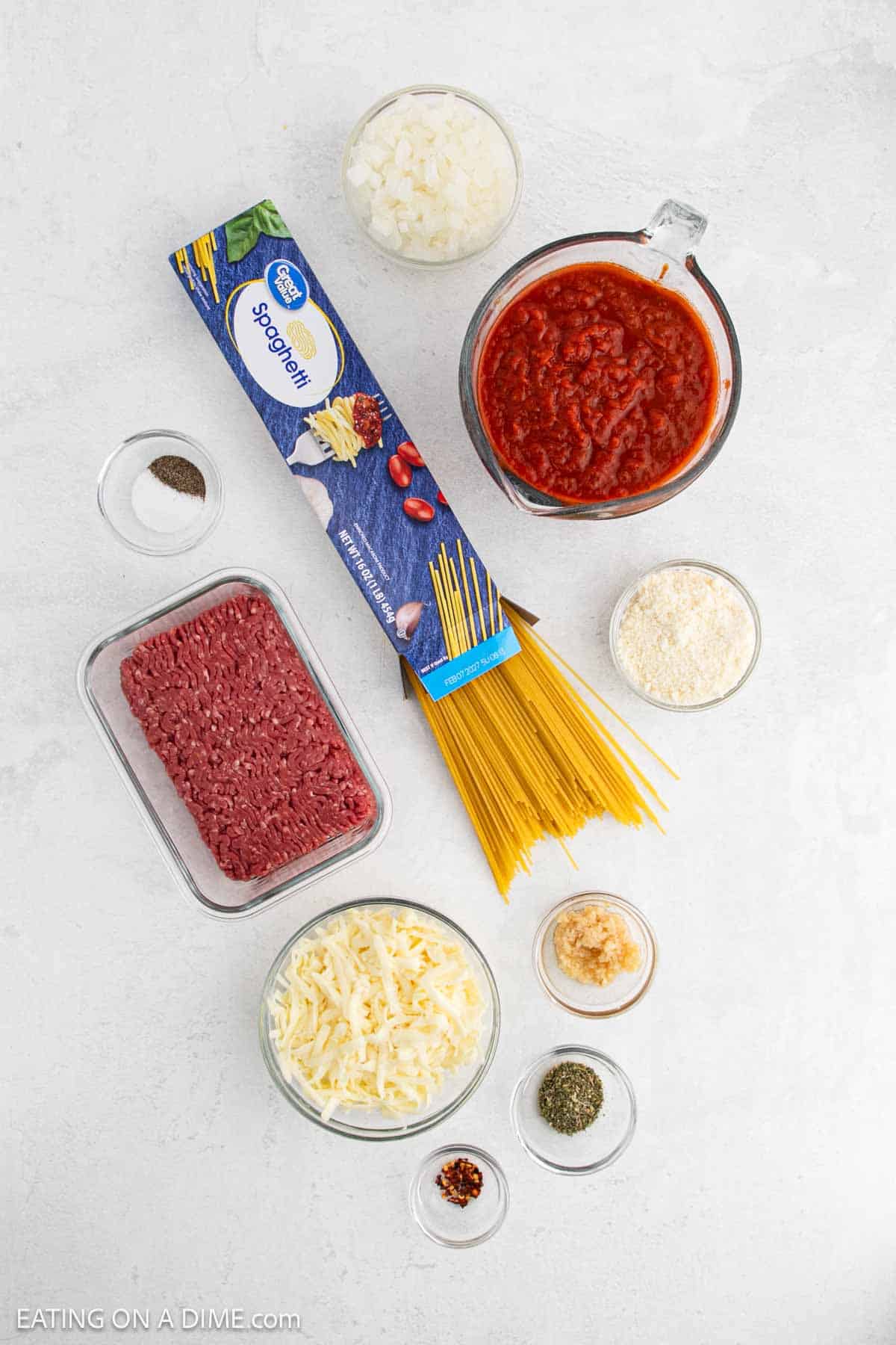 Ingredients - Spaghetti noodles, ground beef, onion, garlic, marinara sauce, Italian seasoning, salt, pepper, red pepper flakes, mozzarella cheese, parmesan cheese