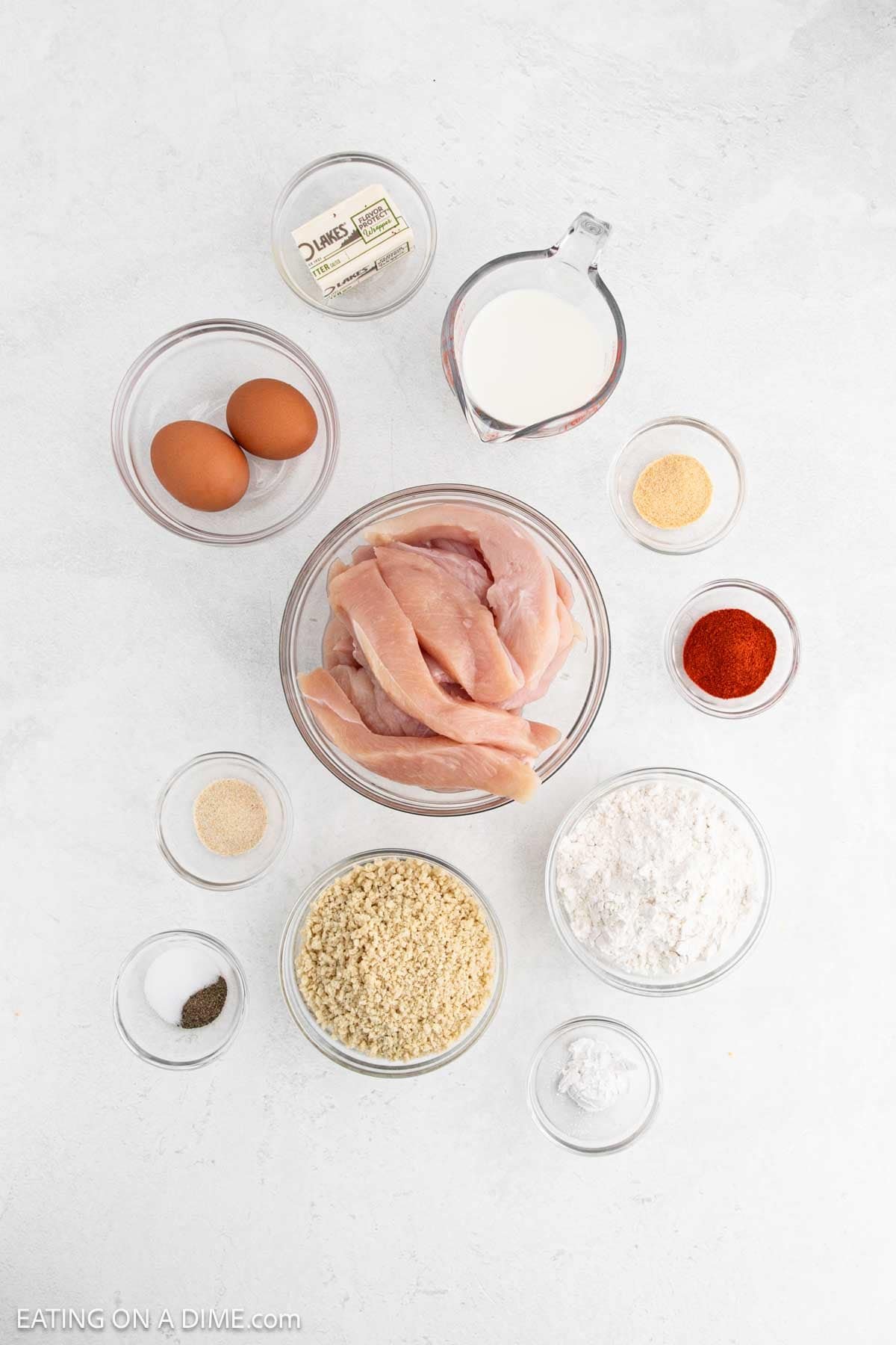 Ingredients - Chicken Breasts, butter, eggs, milk, flour, bread crumbs, salt, paprika, pepper, garlic powder, onion powder, baking powder