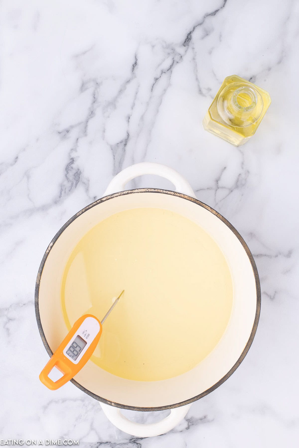 Large pot of oil with a thermometer 