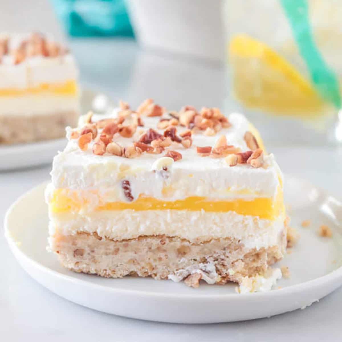 Slice of lemon lush dessert on a plate