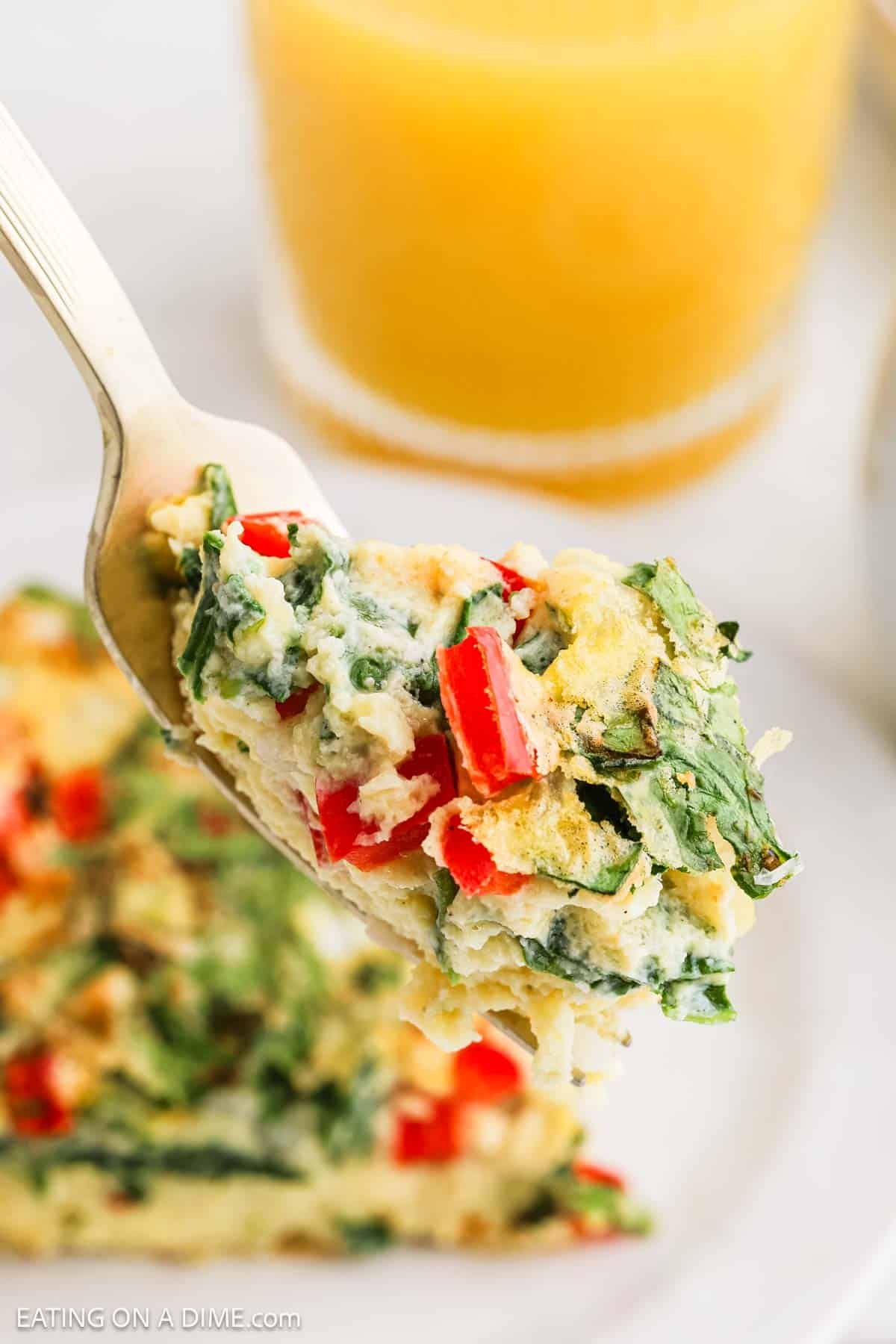 A bite of egg casserole on a fork