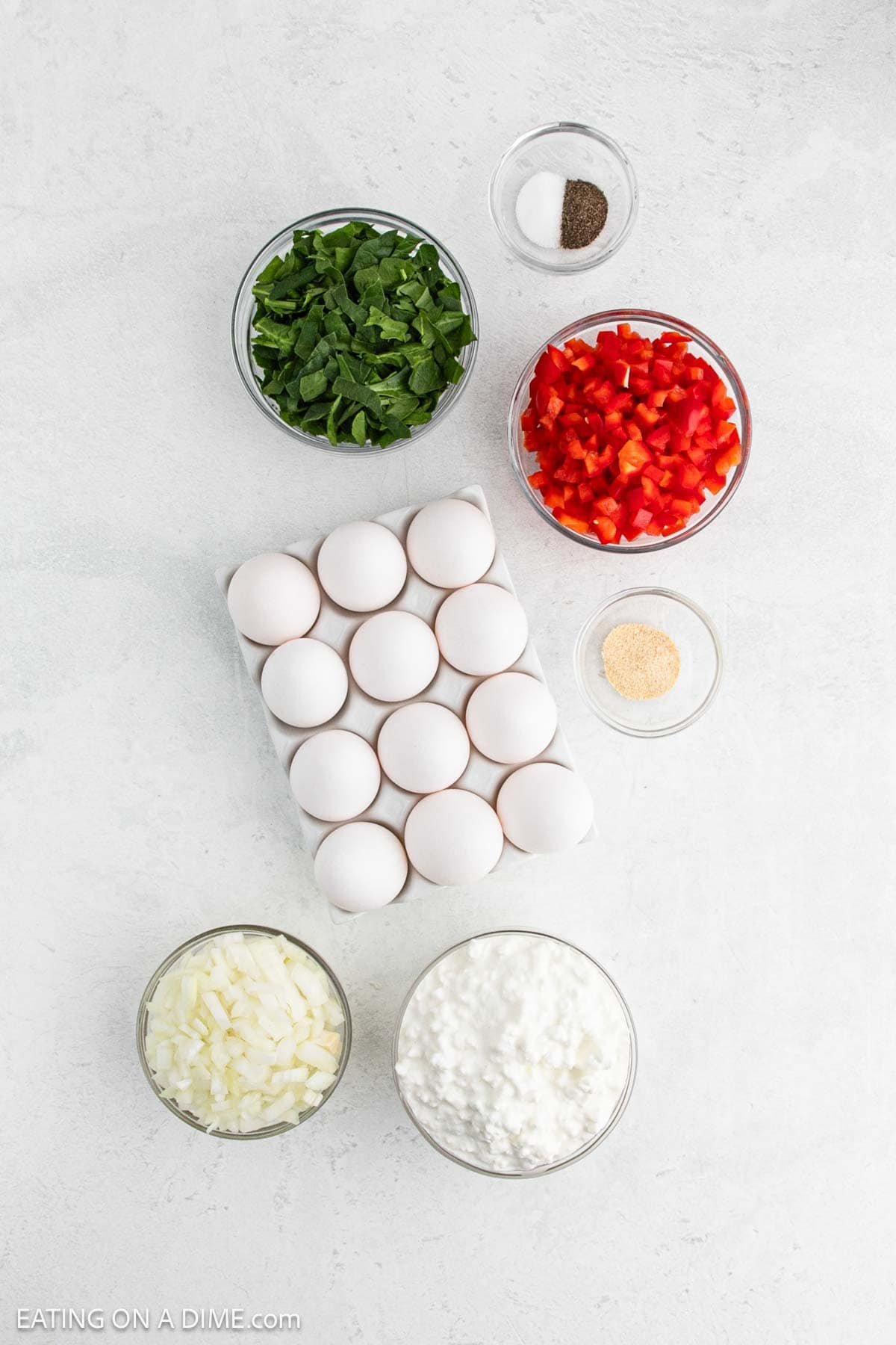 Ingredients - Dozen of eggs, chopped onions, cottage cheese, red bell pepper, chopped spinach, salt, pepper, and garlic powder
