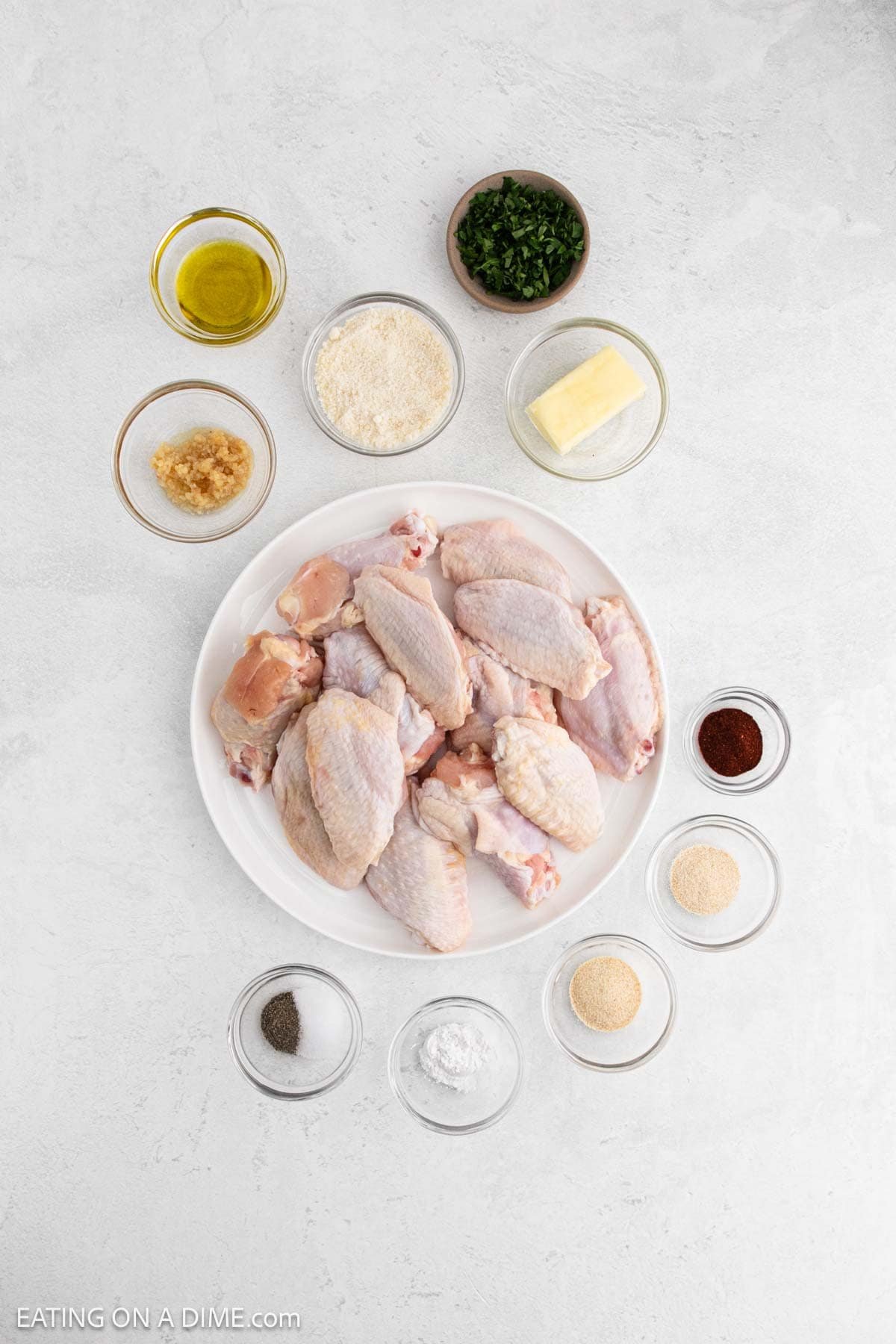 Ingredients - Chicken Wings, olive oil, baking powder, garlic powder, onion powder, smoked paprika, salt, pepper, butter, garlic, parmesan cheese, fresh parsley
