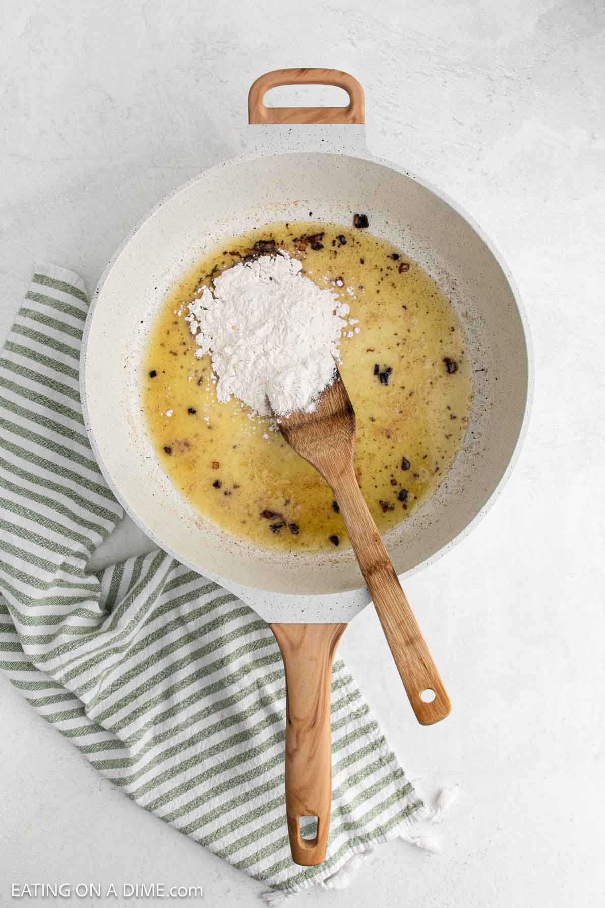 Melted butter with brown bits and topped with flour