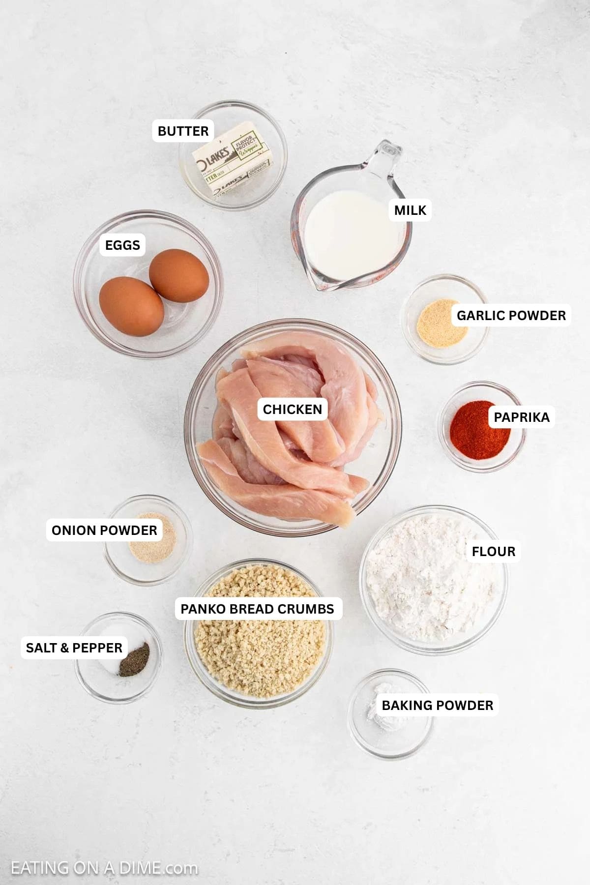Ingredients for recipe: baking powder, salt, pepper, bread crumbs, flour, onion powder, paprika, chicken, garlic powder, eggs, milk and butter.