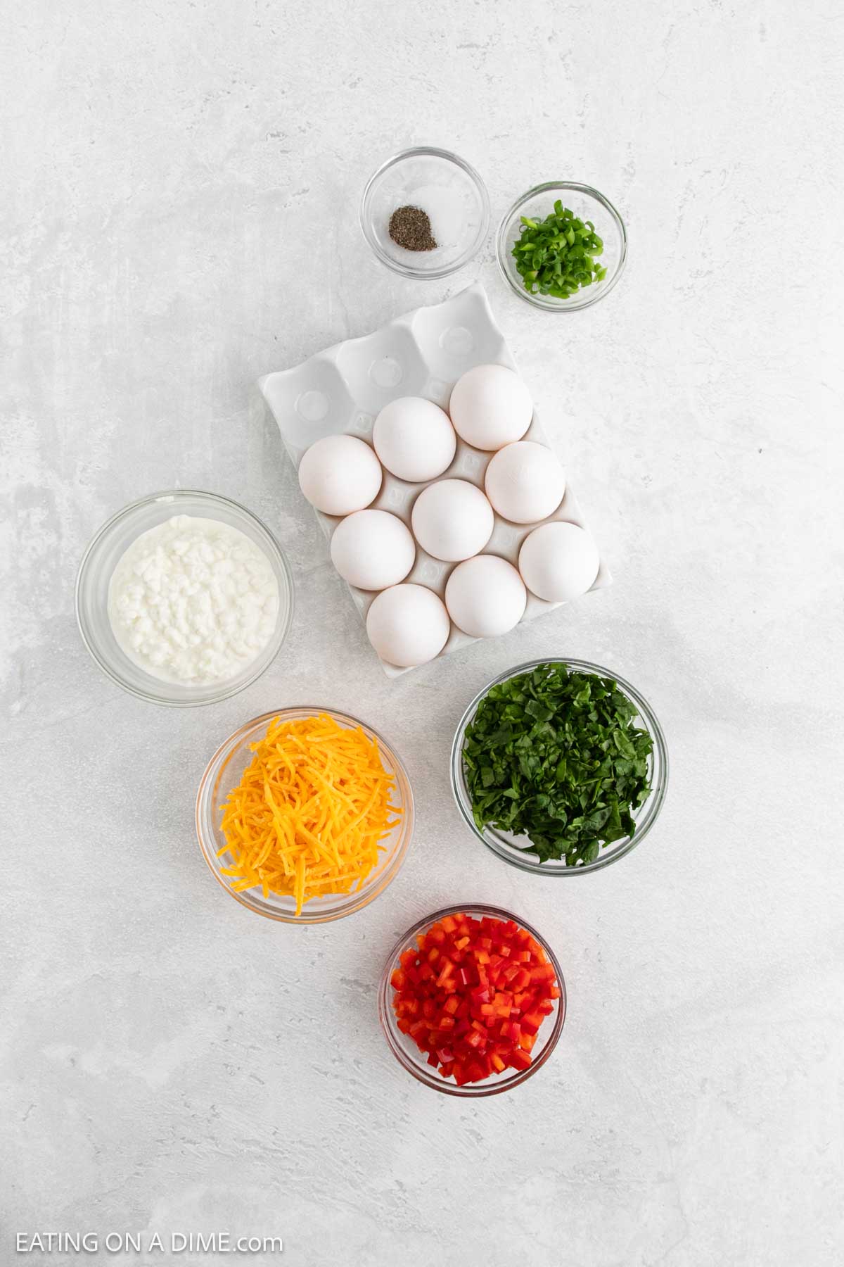 Ingredients - Eggs, cottage cheese, salt, pepper, spinach, red bell pepper, green onions, cheddar cheese