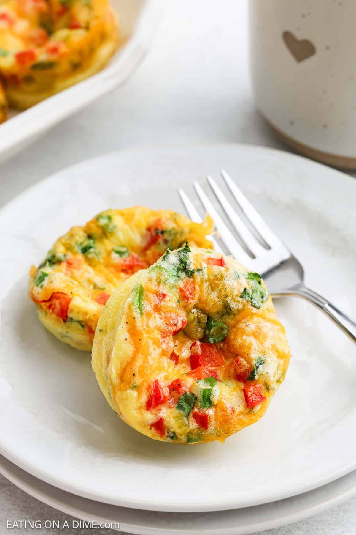 Cottage Cheese Egg Bites on a white plate with a fork