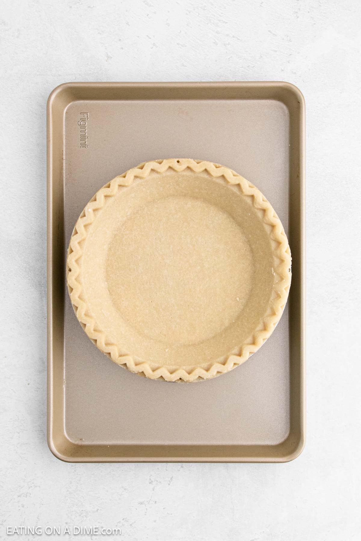 Premade Pie Crust on a baking sheet