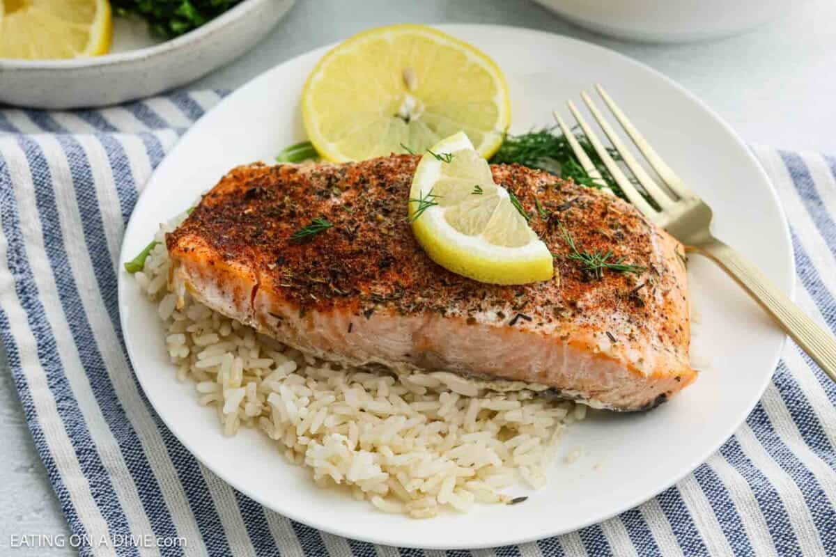 slow cooker salmon on a bed of rice and lemon. The crock pot salmon recipe.