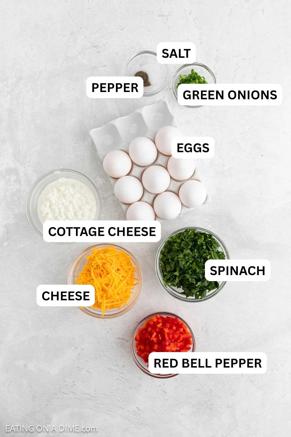 Ingredients needed for this recipe includes Eggs, cottage cheese, salt, pepper, spinach, red bell pepper, green onions, and cheddar cheese.