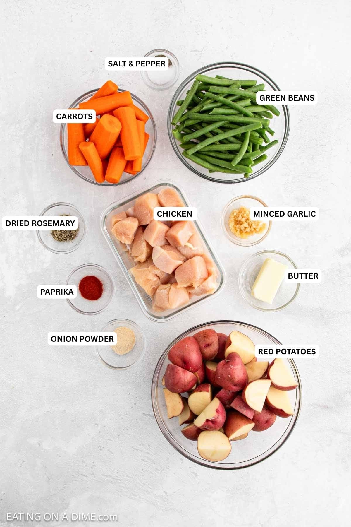 Ingredients for recipe: salt, pepper, green beans, carrots, dried rosemary, chicken, minced garlic, paprika, butter, onion powder and red potatoes.