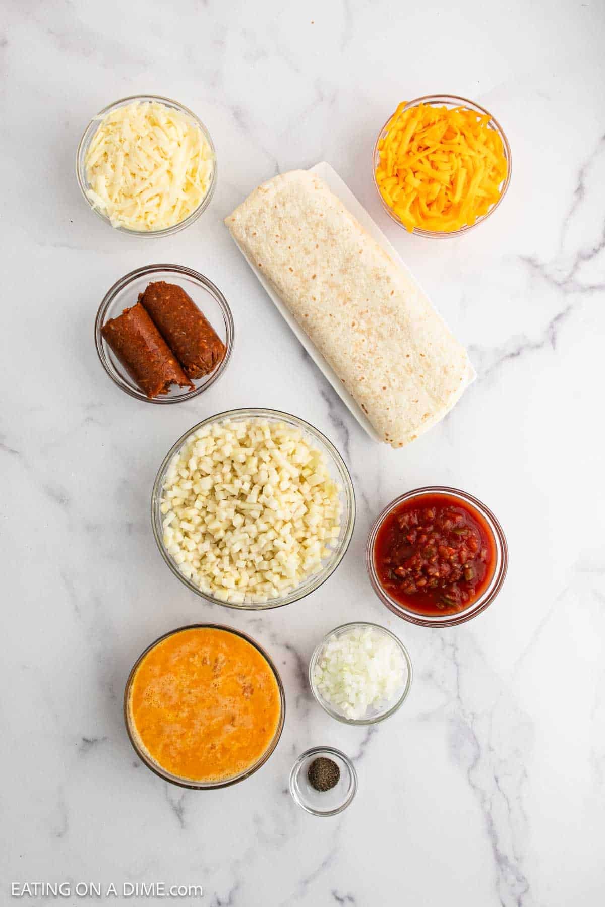 Ingredients - mexican chorizo, potatoes, onion, eggs, salt and pepper, shredded cheese, tortillas, salsa