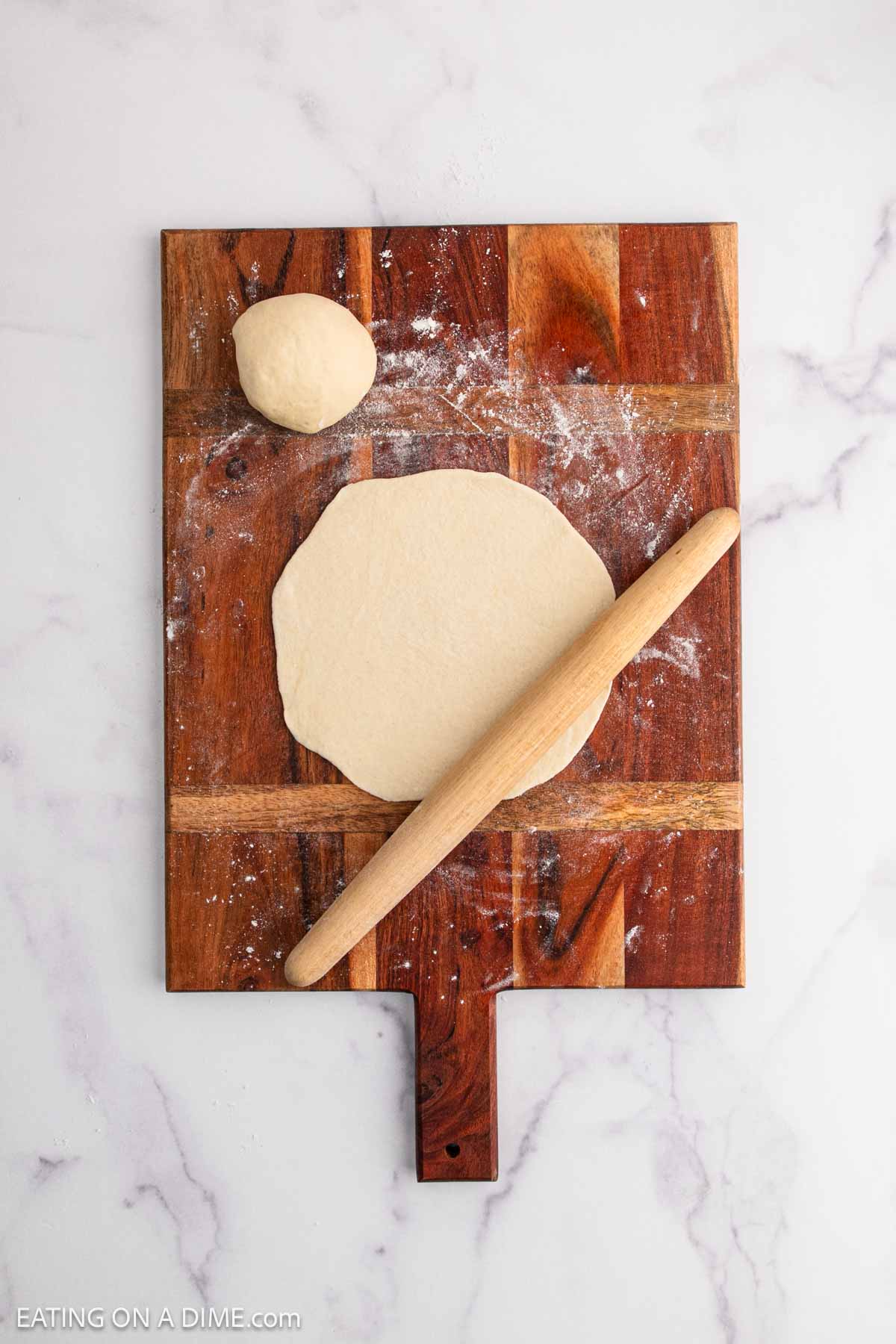 Rolling out the dough with a rolling pin