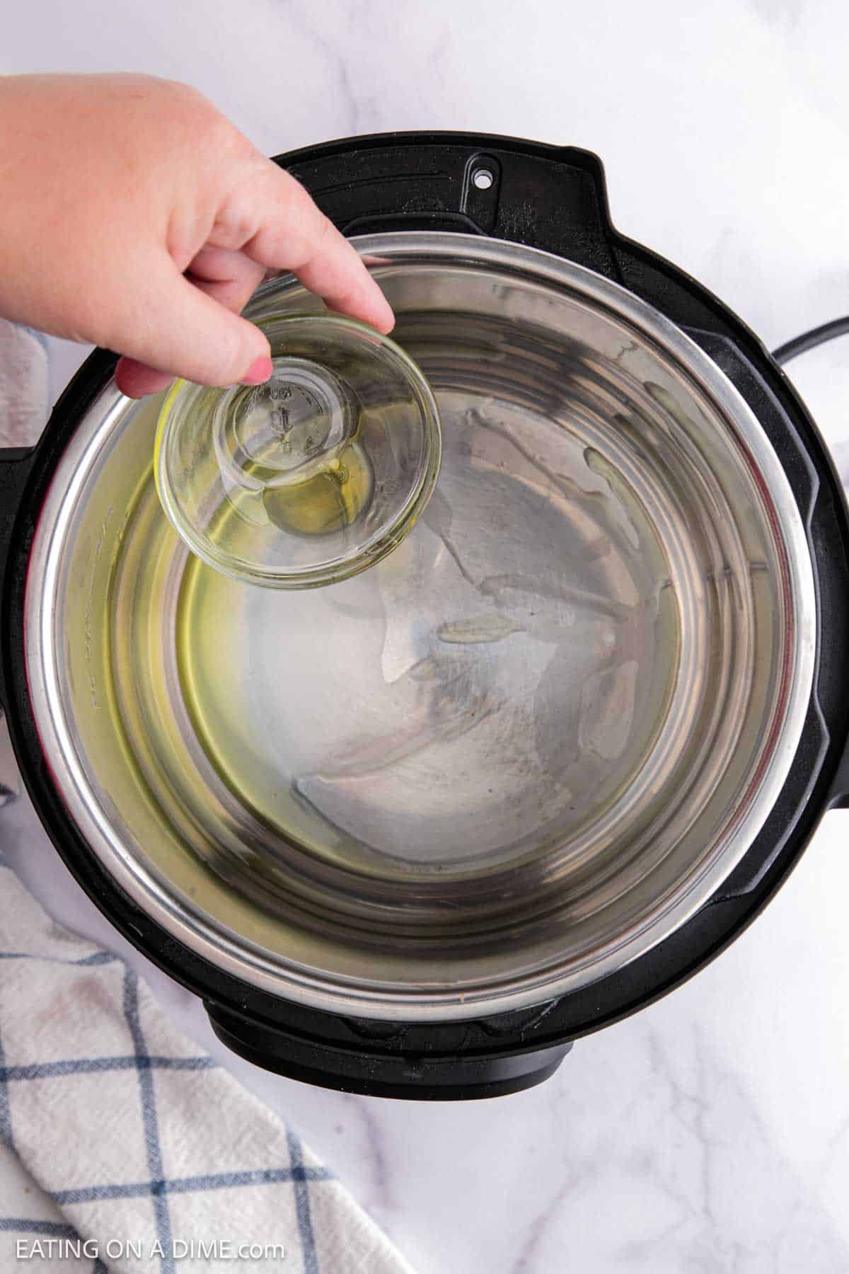 Pouring oil in the instant pot