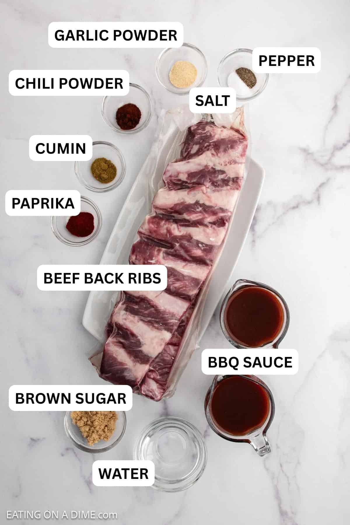 Ingredients needed for this recipe includes Beef Back ribs, brown sugar, paprika, garlic powder, chili powder, cumin, pepper, salt, BBQ sauce, and water.
