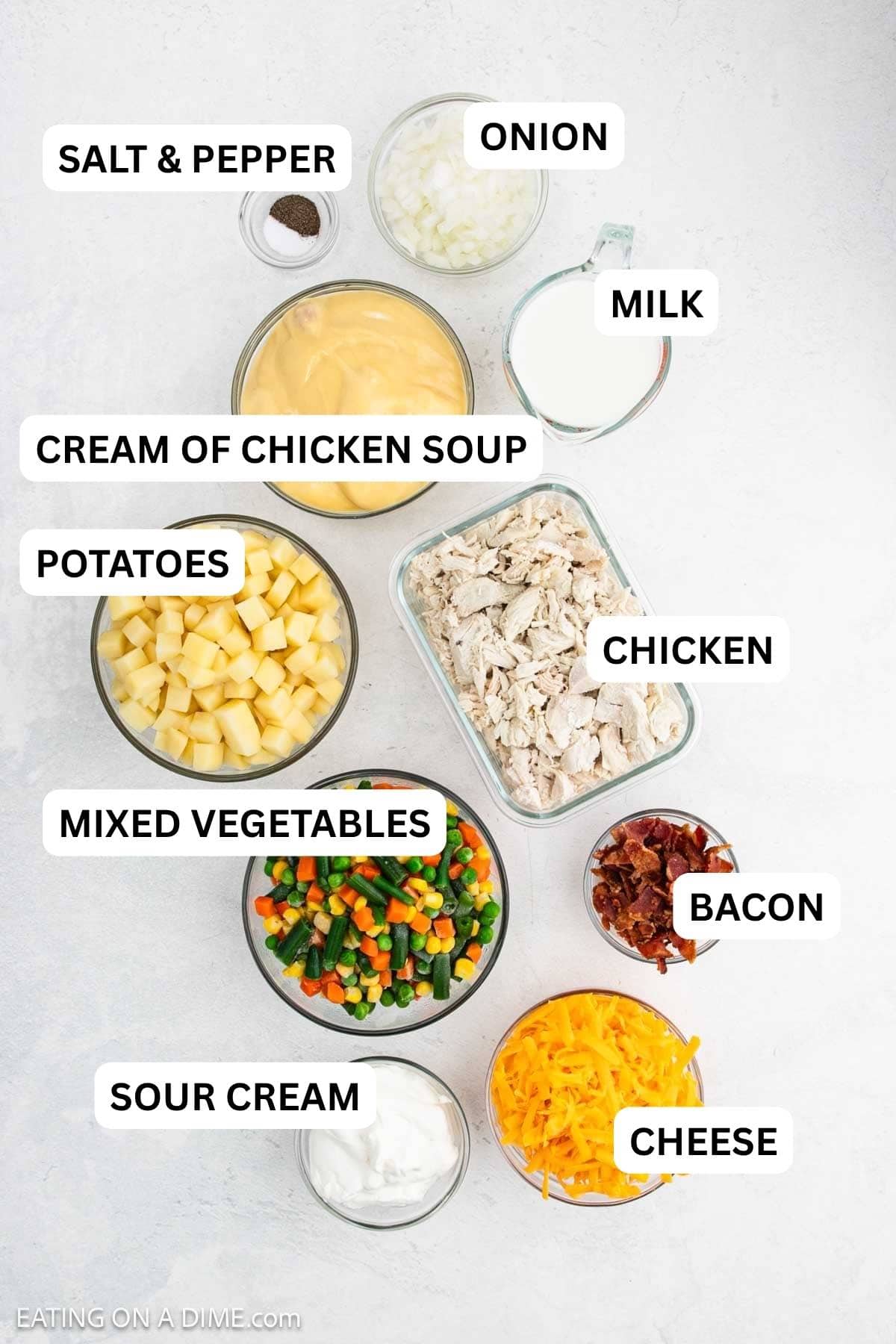 Ingredients needed to make recipe which includes cooked chicken, potatoes, mixed vegetables and more.