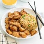 a plate of hibachi chicken with fried rice