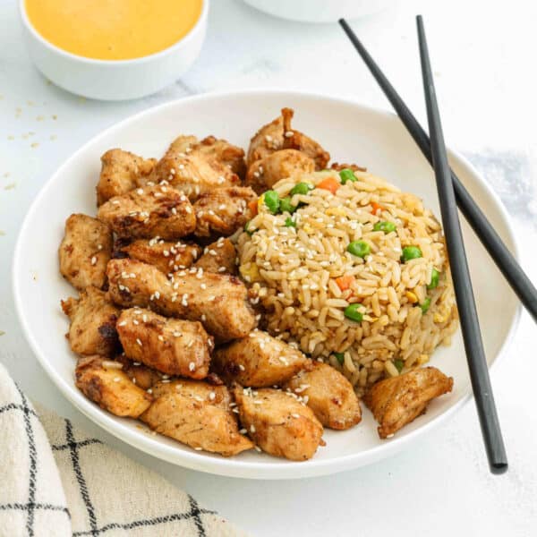 a plate of hibachi chicken with fried rice