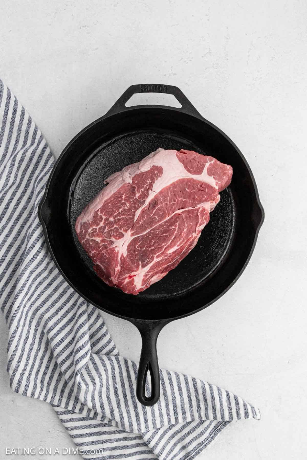 Large roast in a cast iron skillet.