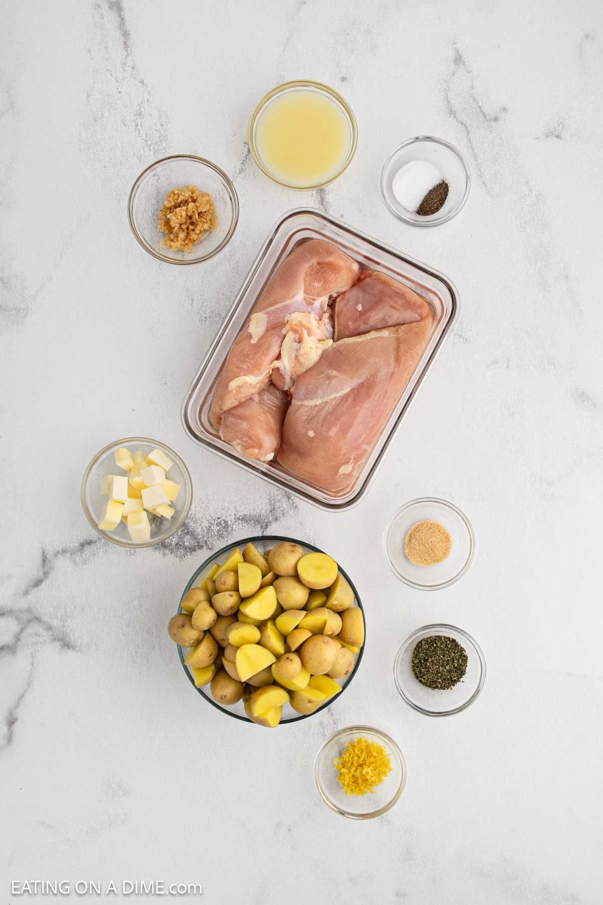 Ingredients need to make this recipes which includes, diced potatoes, chicken breast, butter, minced garlic, fresh lemon and spices.