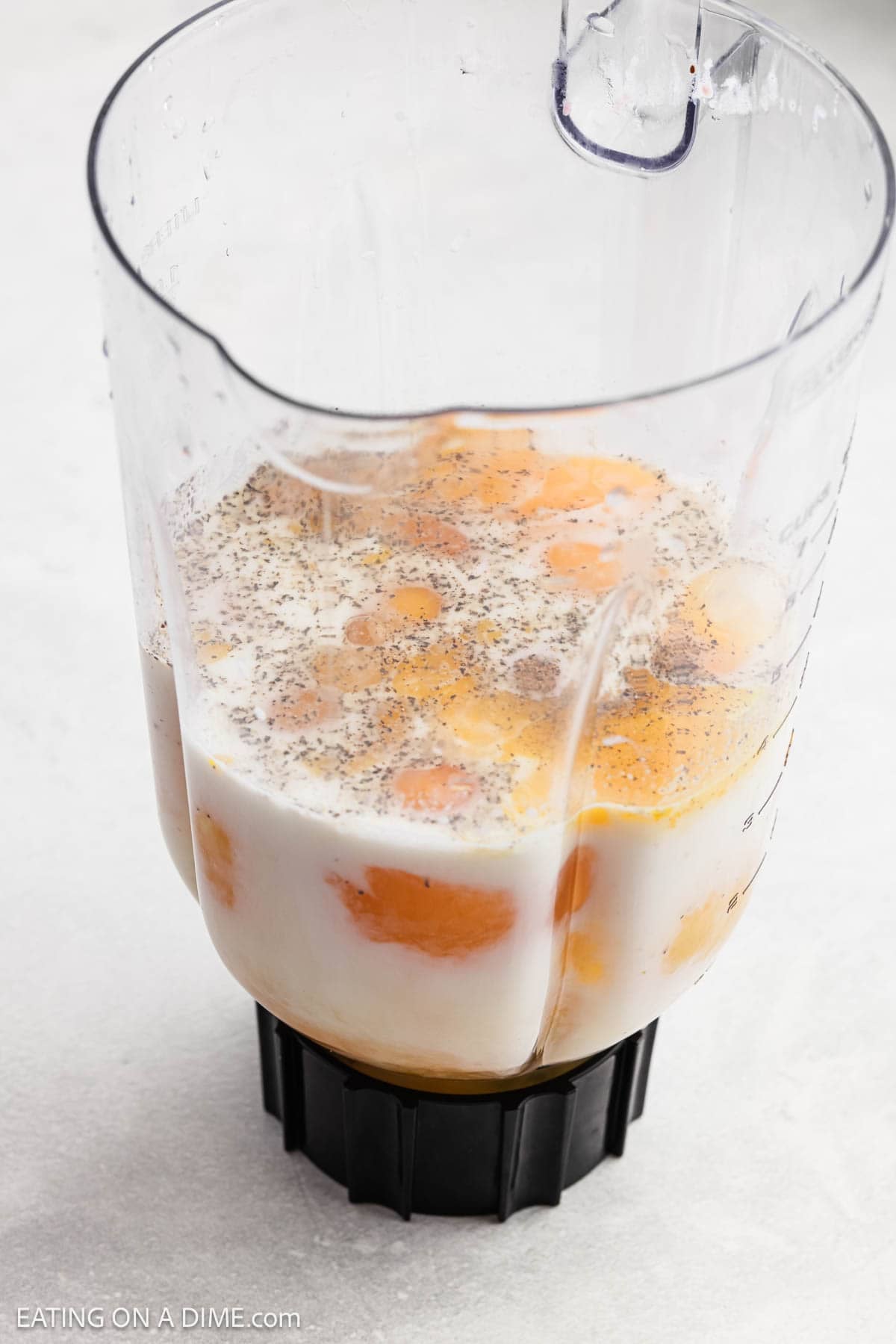Eggs, milk and spices in a blender.