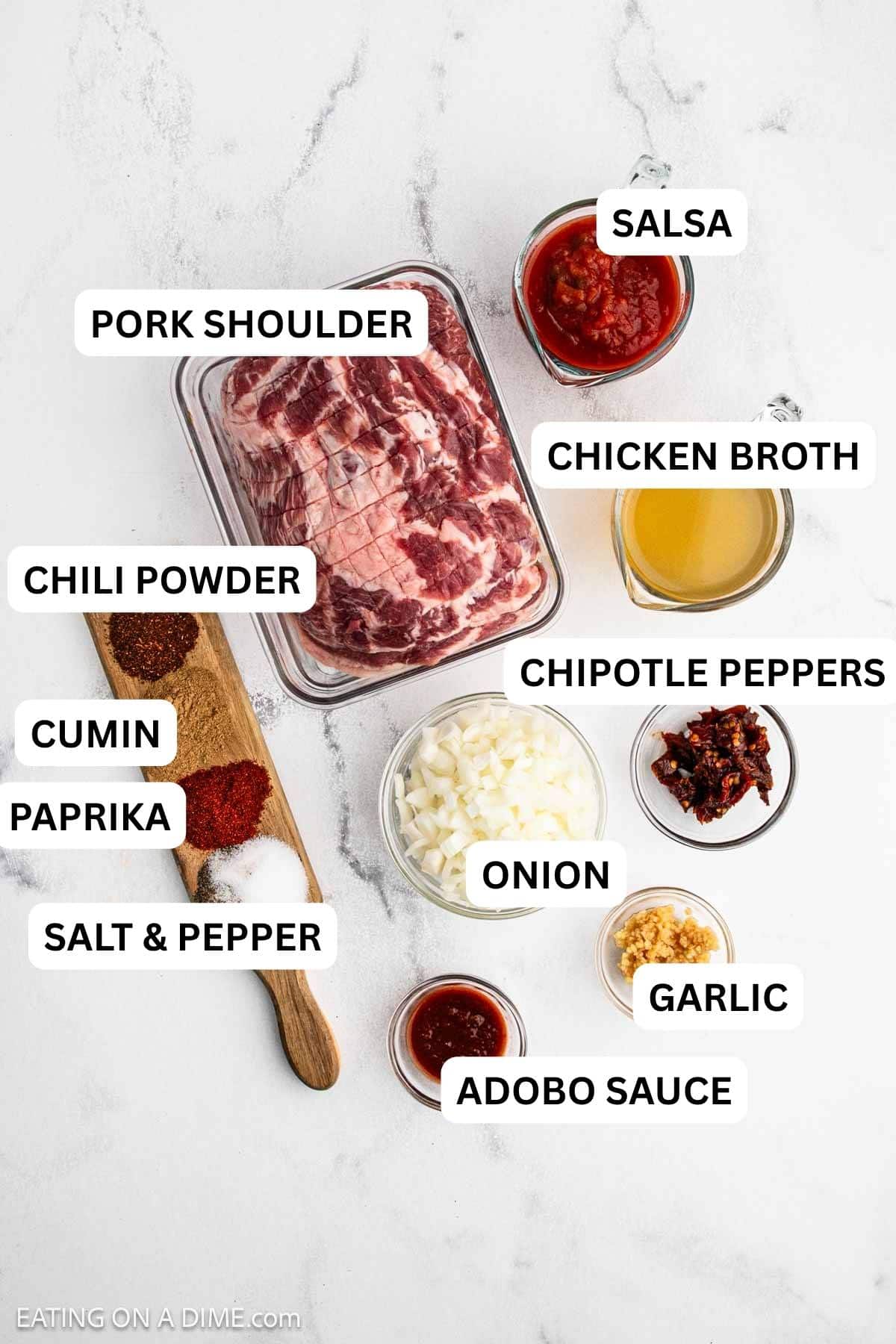 Ingredients needed to make this recipe which includes pork shoulder, spices, chipotle peppers and more.