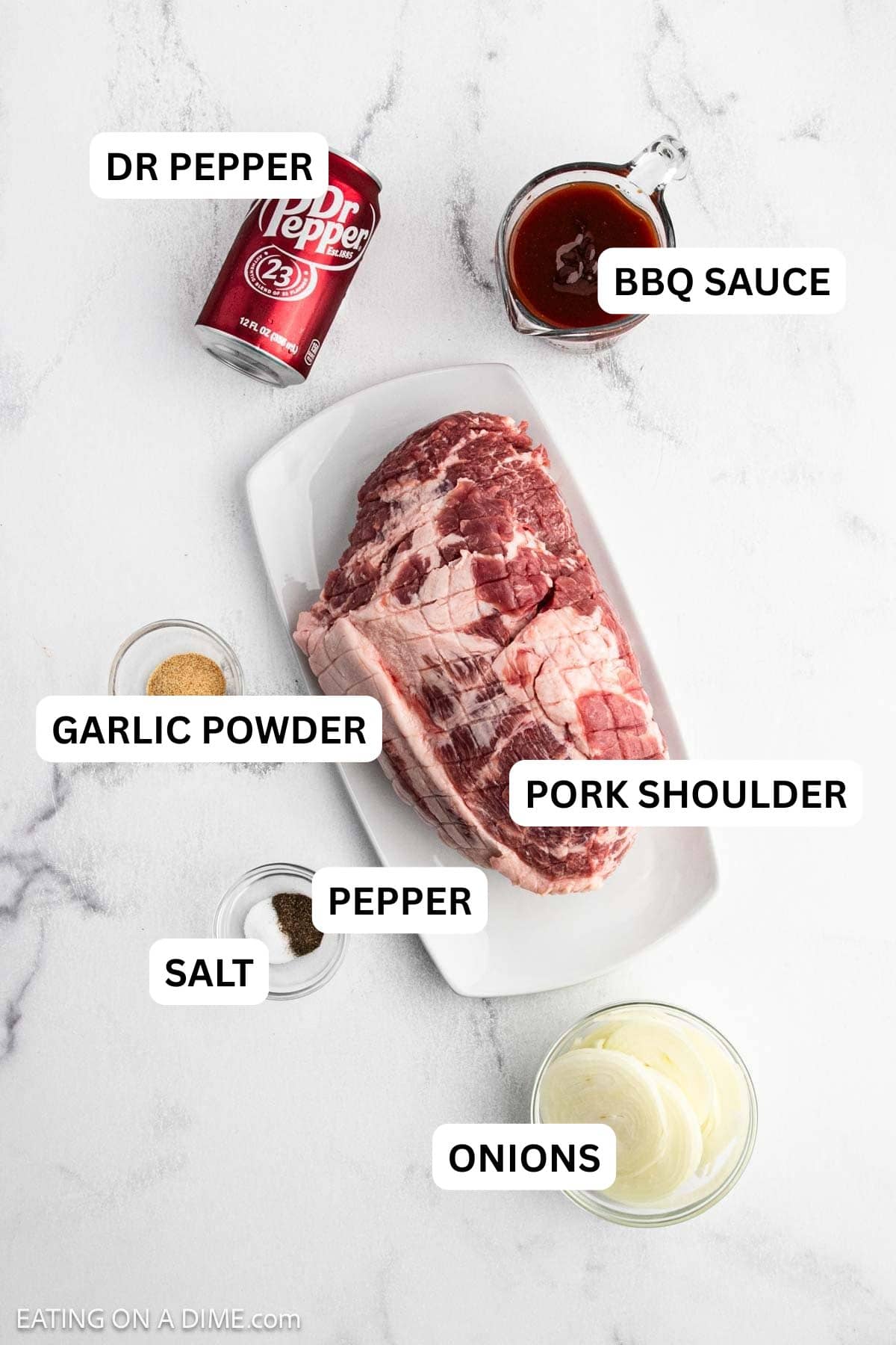 Ingredients need to make this recipe which include pork shoulder, sliced onions, salt, pepper, garlic powder, Dr Pepper, and BBQ sauce.