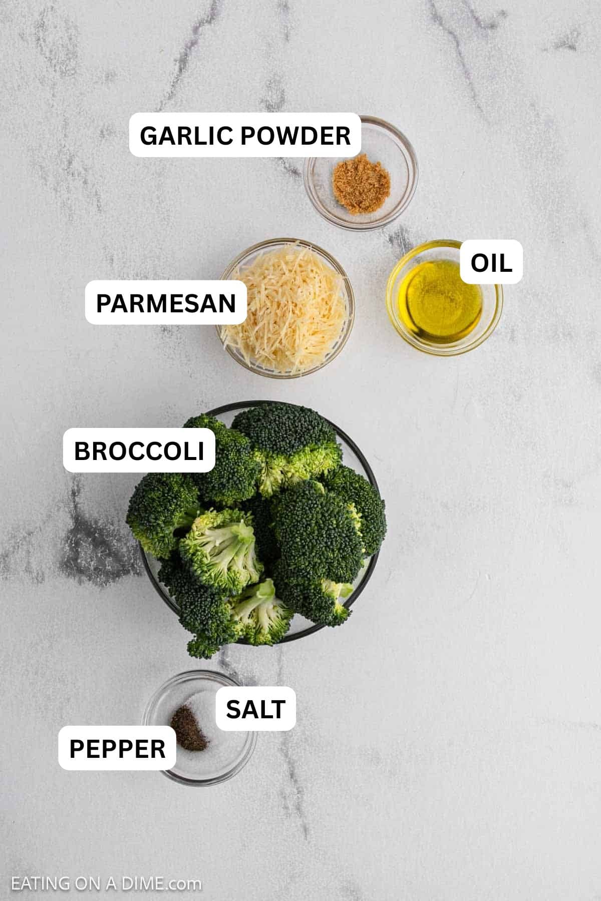 Ingredients need to make this recipe which include fresh broccoli, salt, pepper, shredded parmesan cheese, oil and garlic powder.