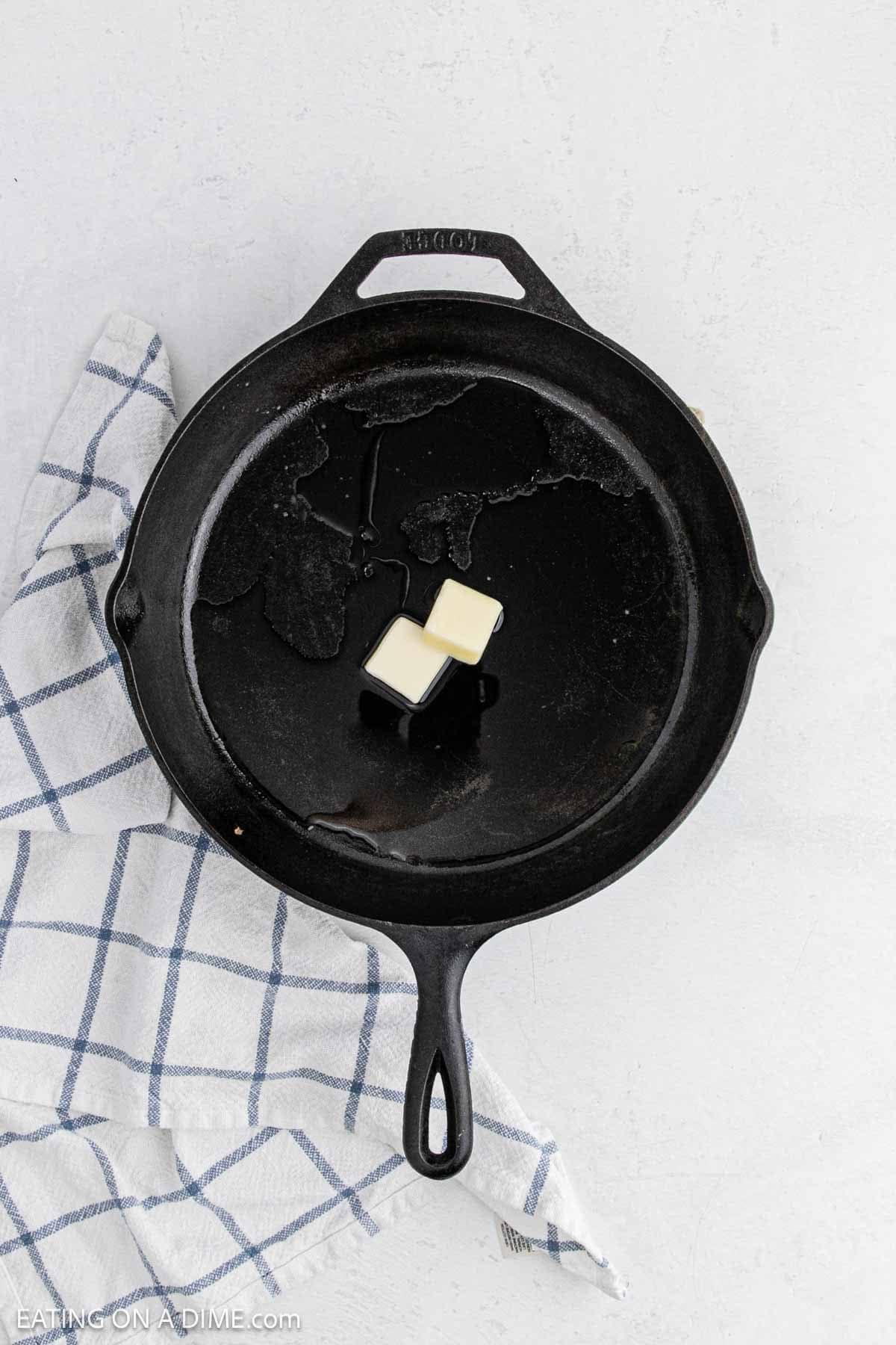 Melted butter in a cast iron skillet.