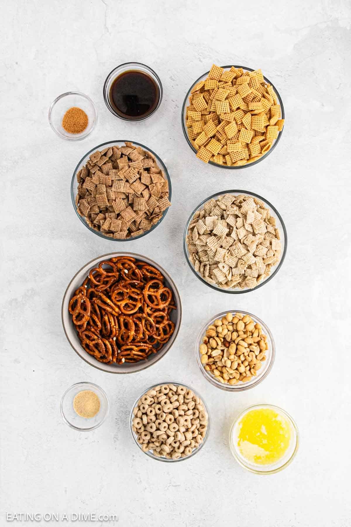 Ingredients needed to make this recipe which includes rice chex cereal, pretzels, cheerios, peanuts, butter, seasoned salt, worcestershire sauce and garlic powder.