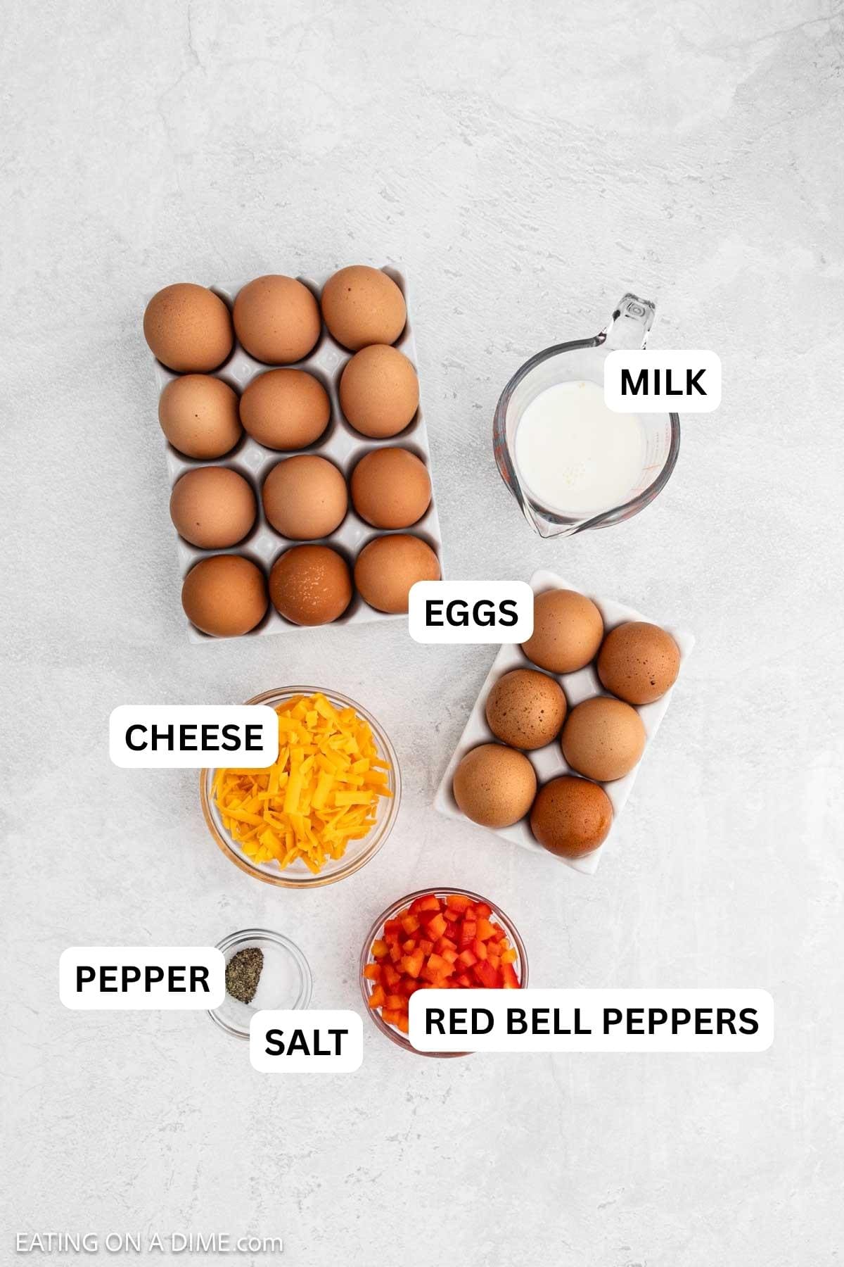 Ingredients needed to make this recipe which includes eggs, shredded cheese, red bell peppers, milk and salt and pepper.