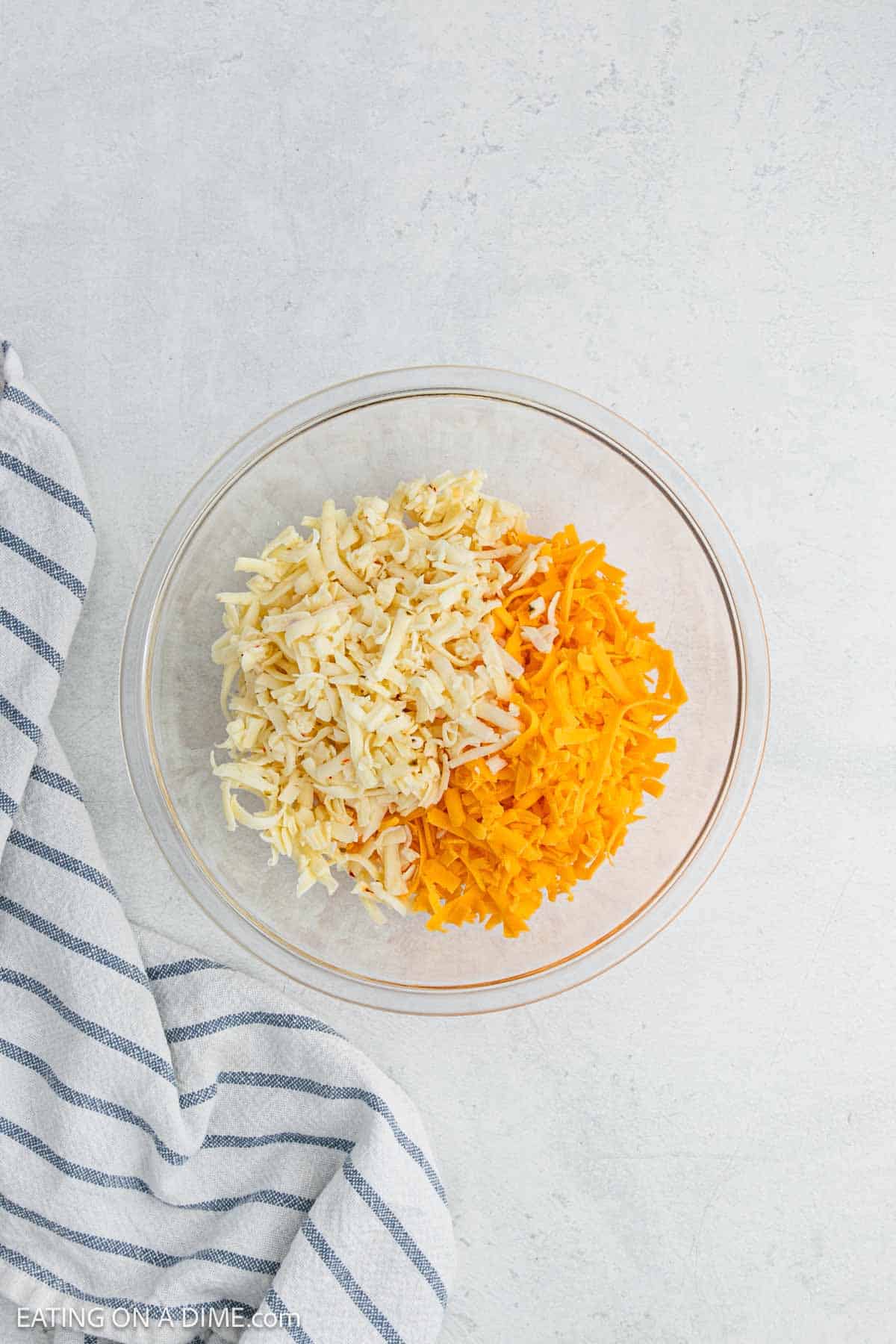 Shredded cheese in a bowl.