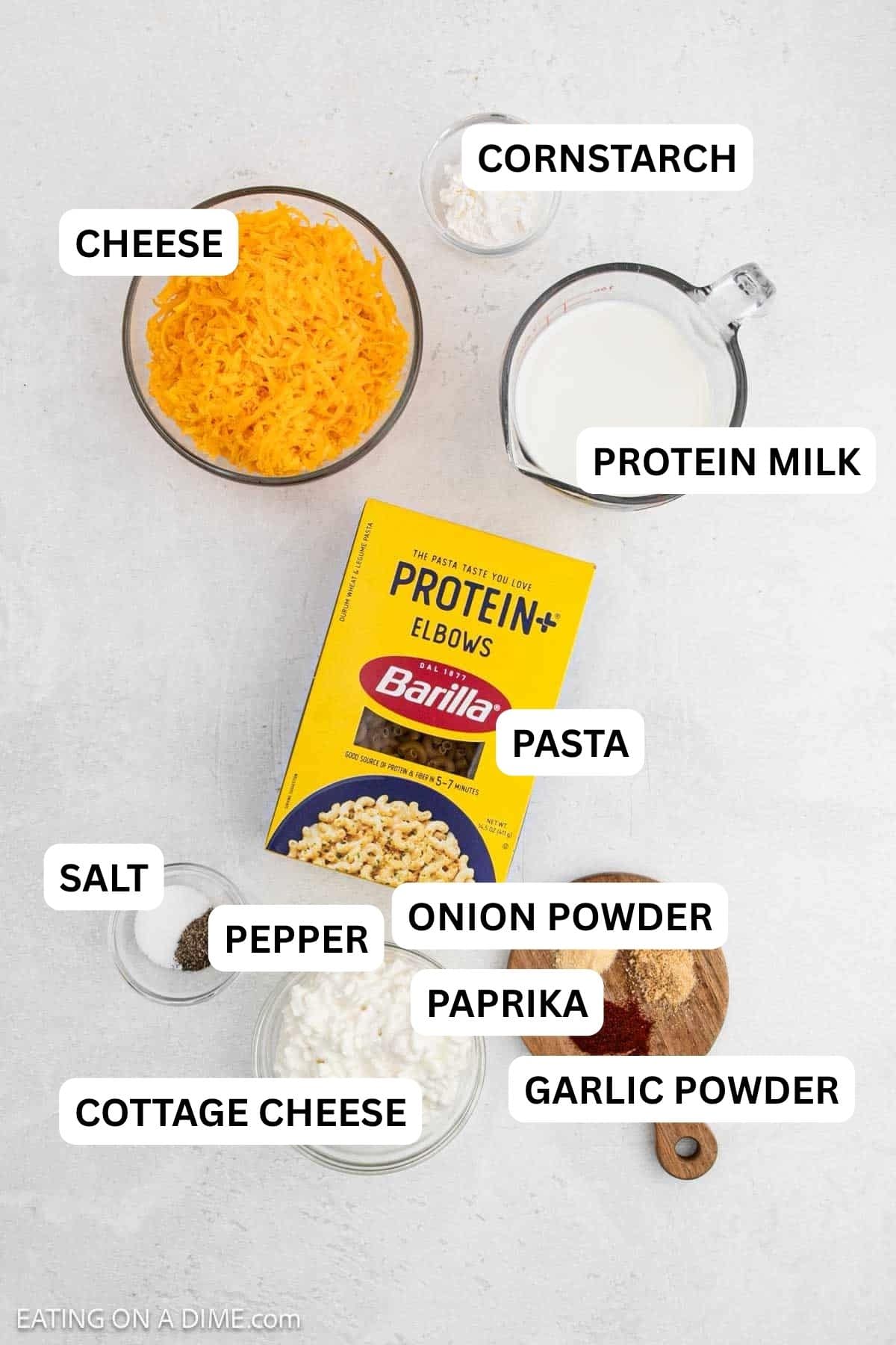 Ingredients needed for this recipe which includes pasta, cornstarch, protein milk, cottage cheese, cheese, salt, pepper, garlic powder, onion powder and paprika.
