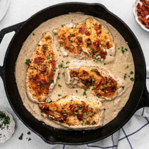 a skillet of smothered chicken