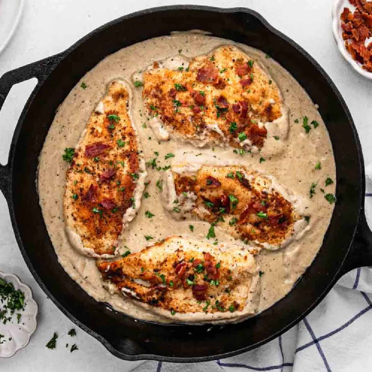 a skillet of smothered chicken