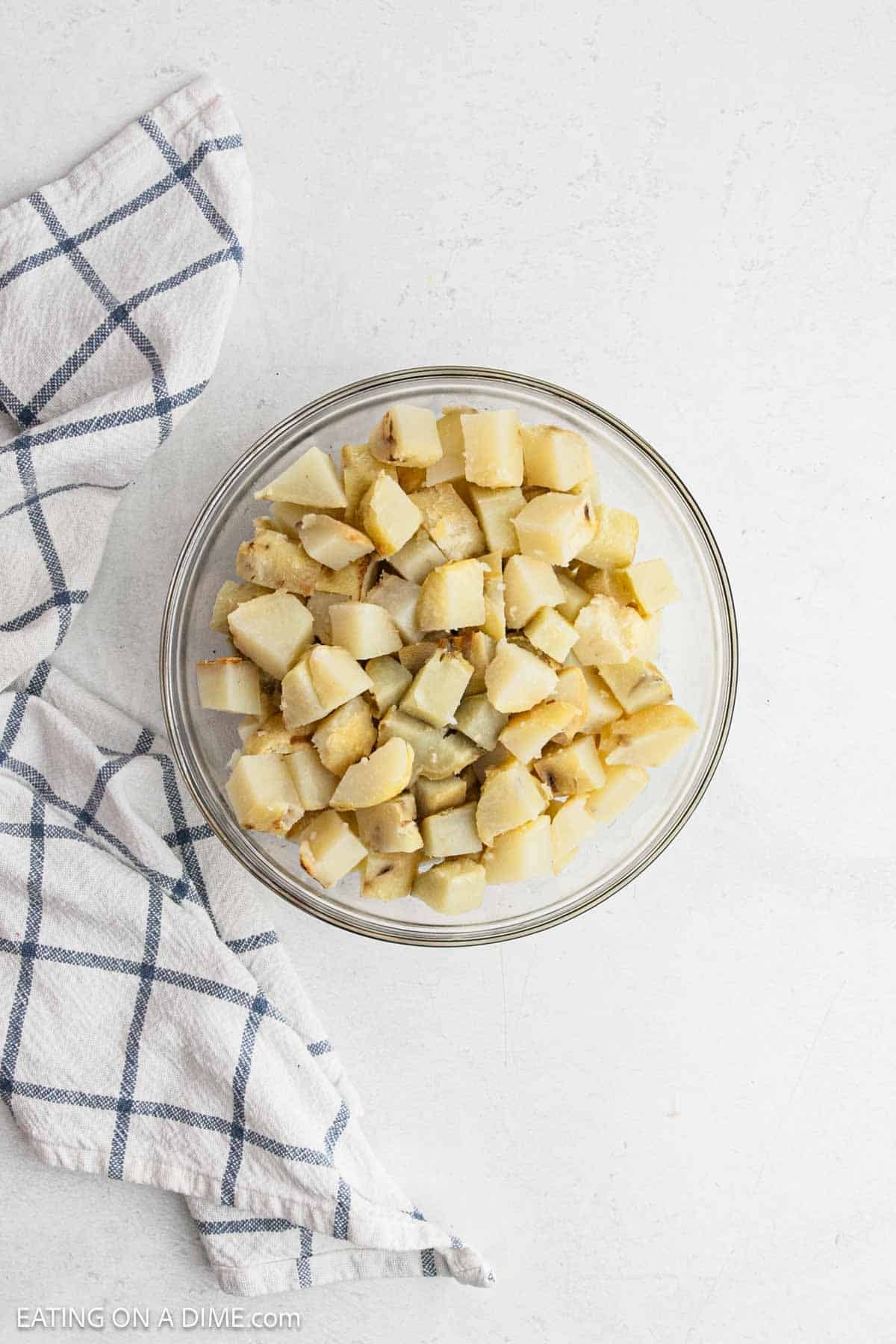 Diced cooked baked potatoes in a bowl.