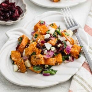 Sweet potato salad serving on a white plate.