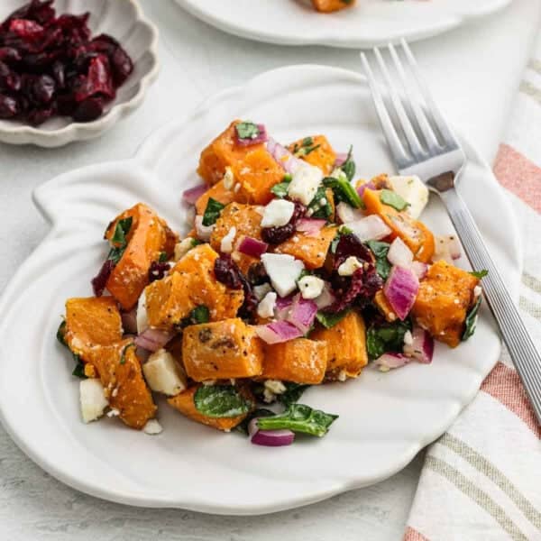 Sweet potato salad serving on a white plate.