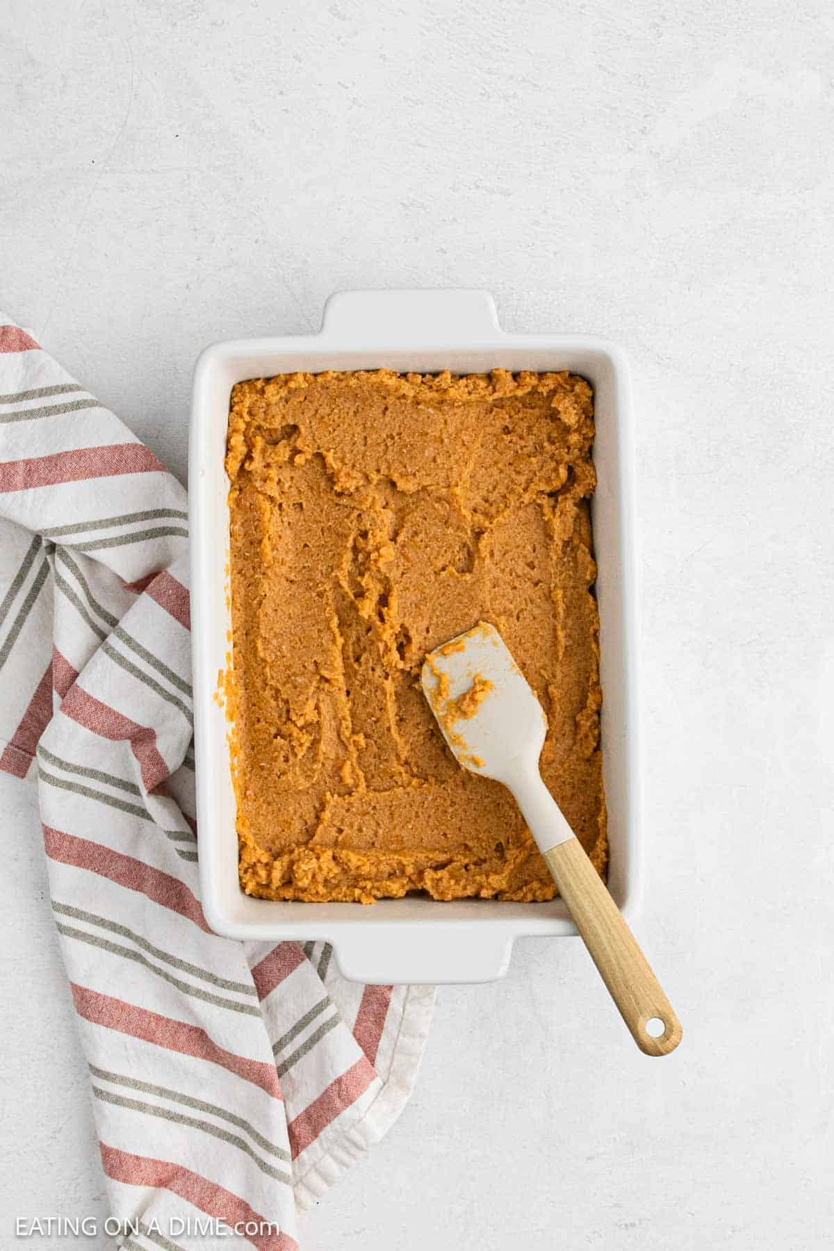 Yams mixture spread into the baking dish.