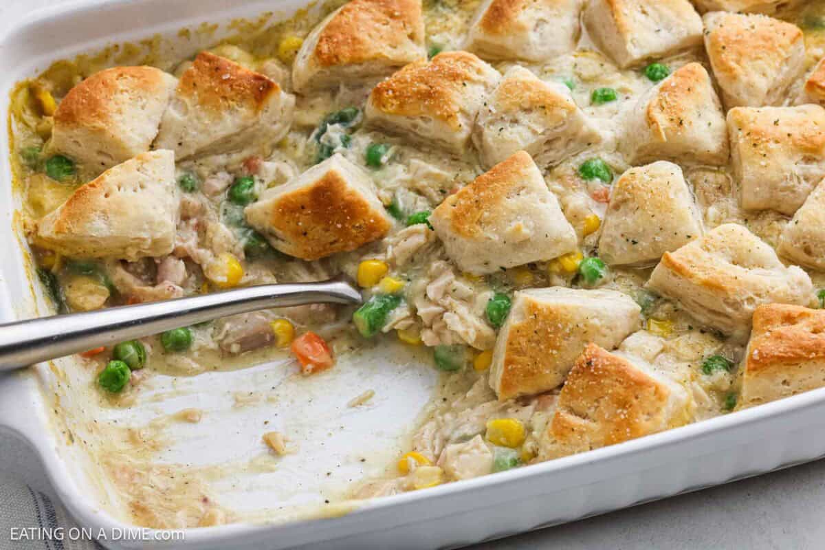 Chicken pot pie casserole with biscuits ready to serve in a baking dish.