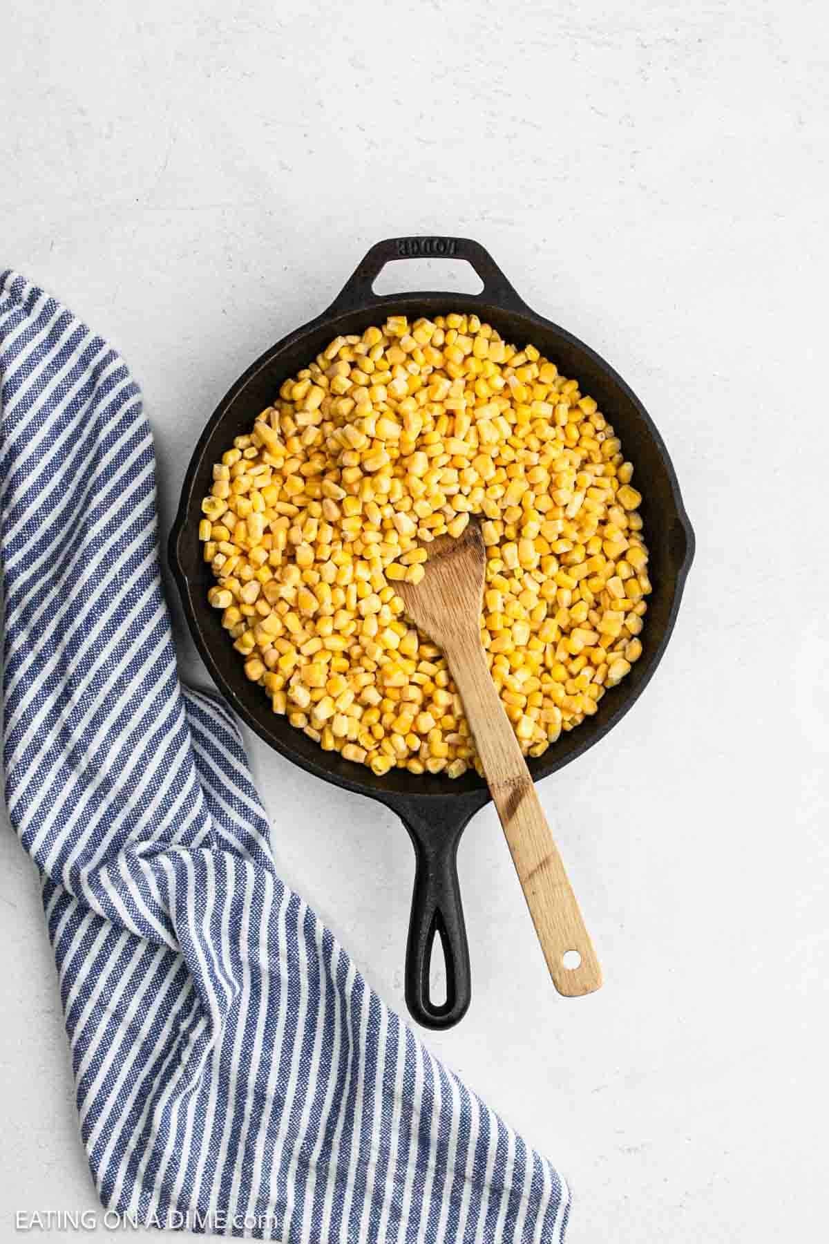 Corn kernels in a cast iron skillet.