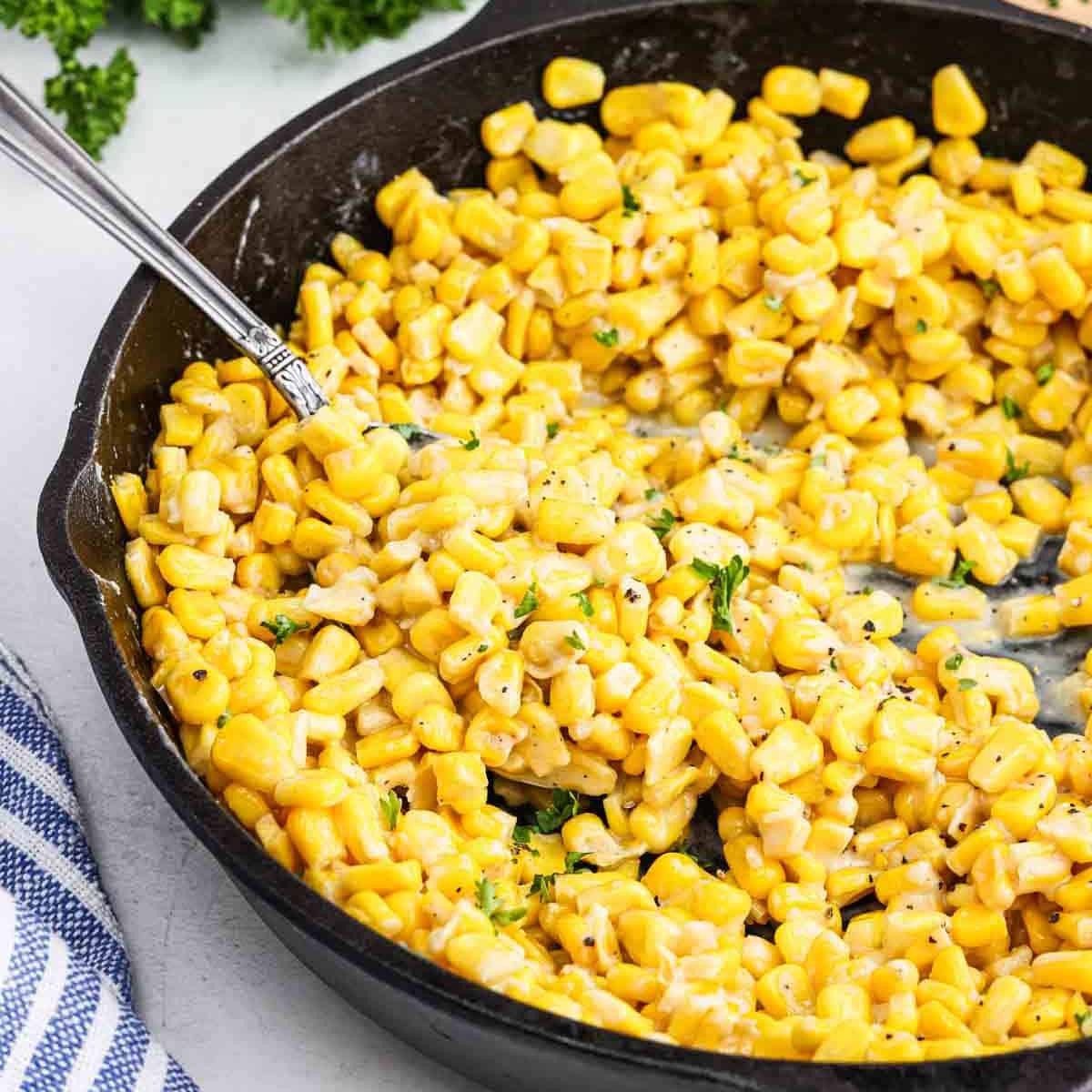Honey butter skillet corn in a cast iron skillet.