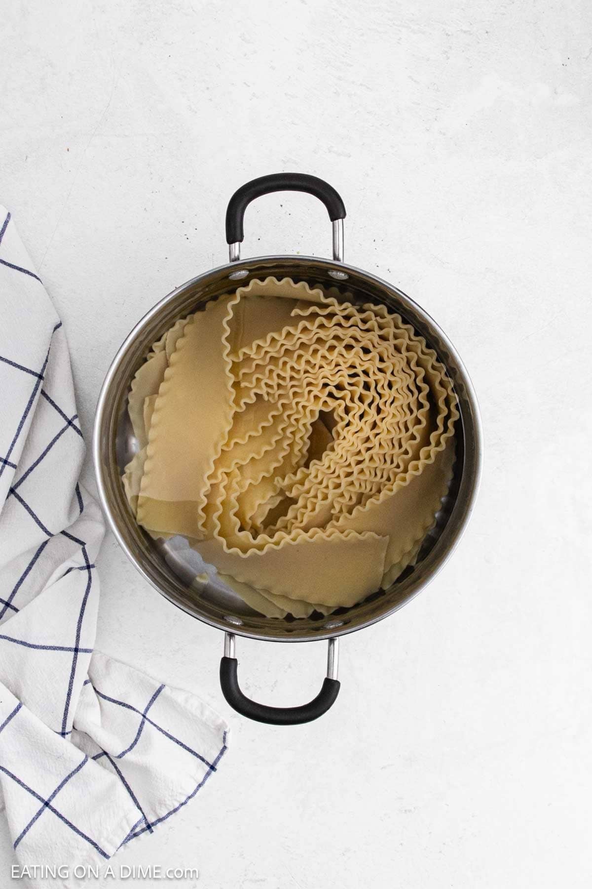 Cooked lasagna noodles in a large pot of water.
