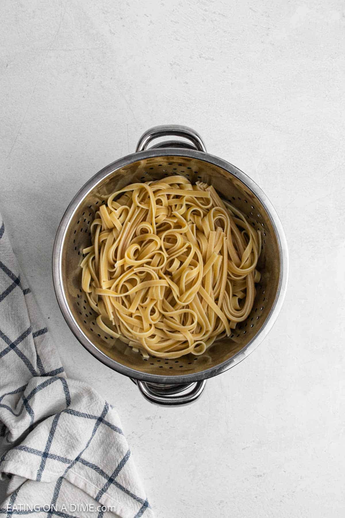 Cooked fettuccine pasta in large pot.